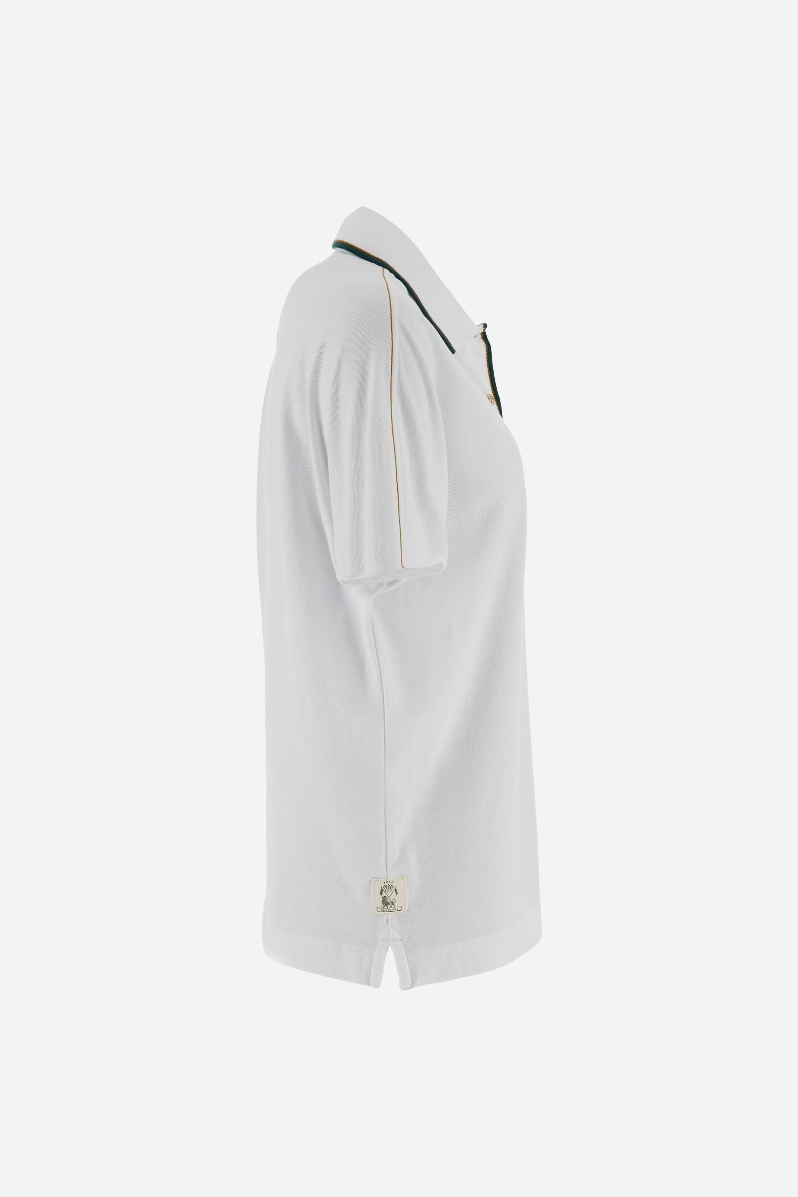 Women’s short-sleeve polo in stretch piqué with deep four-button placket and custom gold buttons. Ribbed collar with contrast stripe detail and matching ribbed cuffs. Regular fit with side slits. Large heraldic “Guards Polo Club” embroidery on the chest and contrast LM monogram on the upper back. The model wears size 2. - Optic White