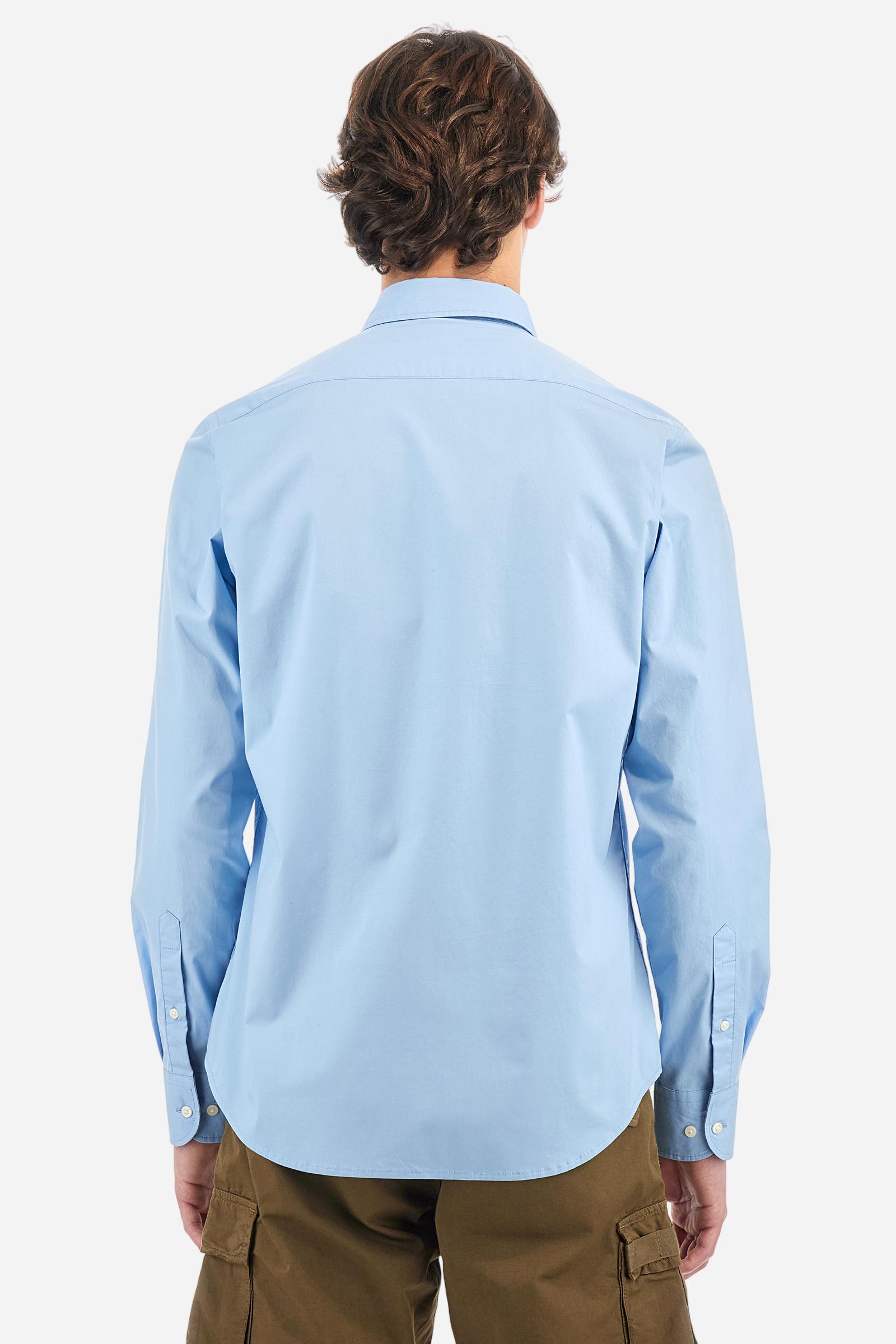 Men's plain long-sleeved shirt made from stretch cotton poplin for a comfortable fit. Featuring a button-down collar and woven labels at the bottom of the opening. A multicoloured logo is embroidered on the chest, over the heart, in contrasting thread. The slim fit ensures a sleek and modern look. The model is wearing a size L. - Blue Bell