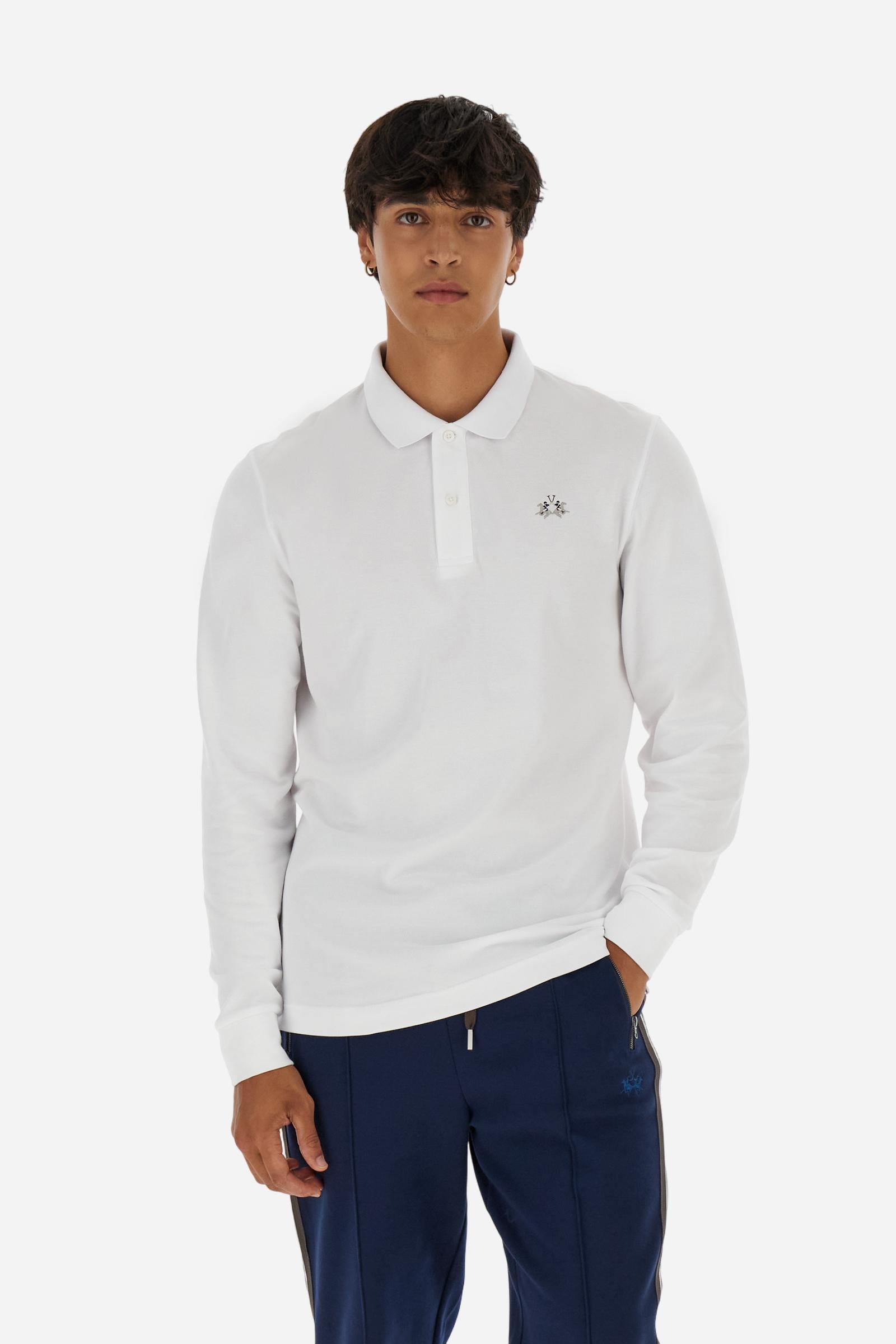 Men’s long-sleeve polo in high-quality stretch cotton piqué for comfort and flexibility. Tone-on-tone ribbed collar with contrast gabardine undercollar embroidered with the brand’s iconic lettering, revealed when the collar is lifted. Contrast embroidered logo on the chest. Slim fit, offering a modern silhouette that enhances the body while ensuring freedom of movement. Model wears size L. - Optic White
