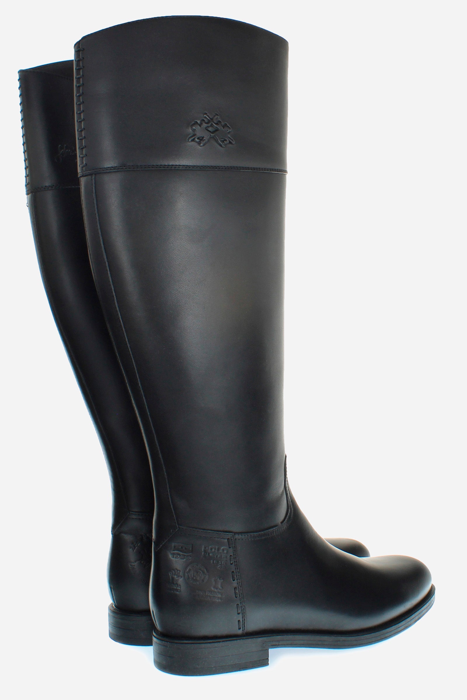 Equestrian-inspired women's boot in soft cowhide with a clean style.An emblematic model with the unique savoir-faire of La Martina. The horse logo is embossed on the side upper leg. Customised metal rivet detailing on the lower side. This is complemented by the craftsmanship of the hand-stitching. With an extremely versatile and current country chic style. - BLACK