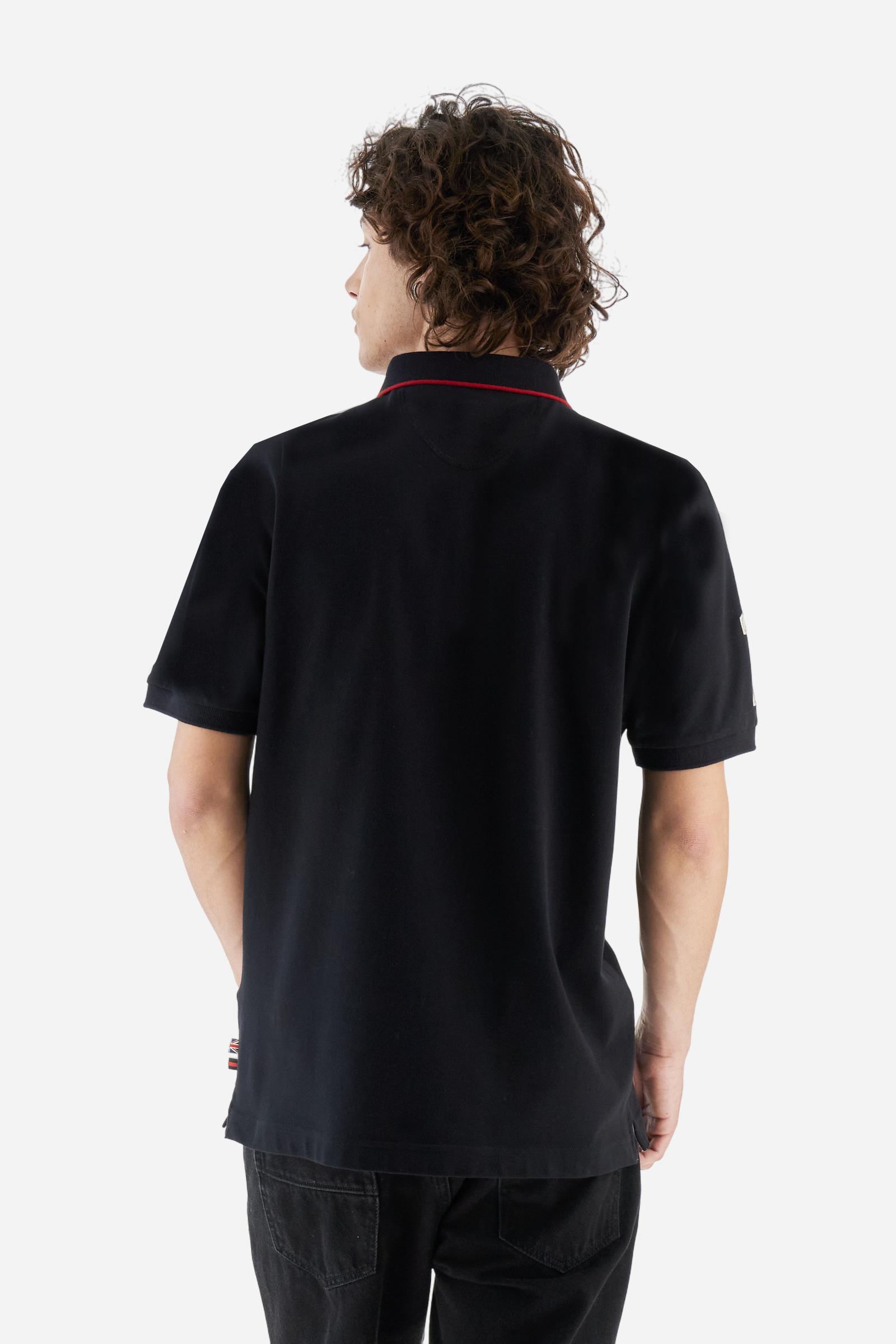 Short-sleeve polo shirt from the Guards capsule, made of high-quality stretch cotton piqué. Ribbed collar and cuffs in matching tone, with contrast striped detail on the collar. Three-button personalized placket. Multicolor graphics, patches, and lettering celebrate the British regiment, applied to chest and sleeves. Brand logo embroidered in contrast on the left sleeve. Regular straight fit. Model wears size L. - Black
