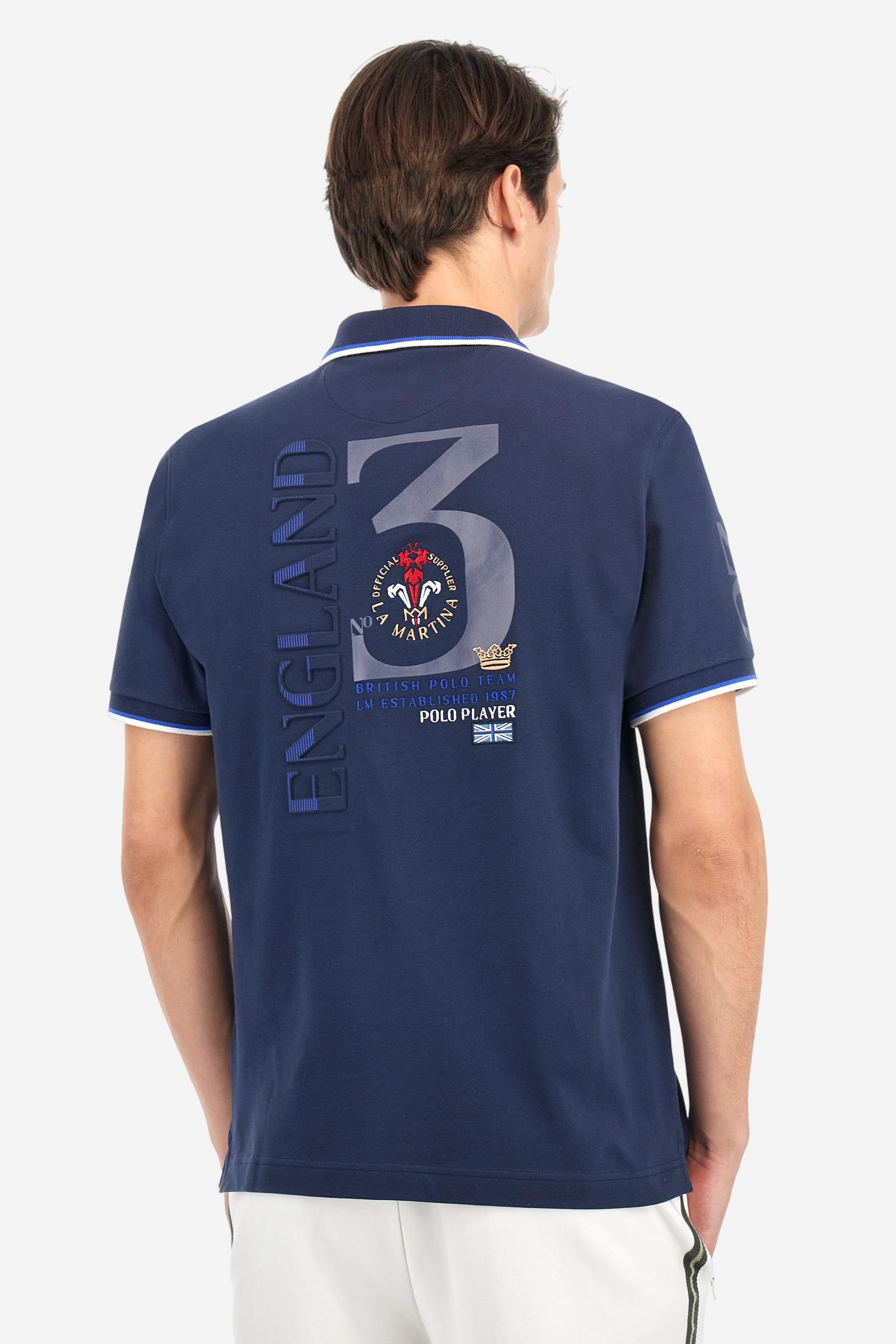 Men's solid color polo shirt, made of slightly elasticated cotton piqué. Two-button closure. Ribbed collar and sleeve hems, with a contrasting two-tone detail at the bottom of the sleeves. The entire garment features details crafted using mixed techniques. Both the front and back display embroidery and prints. The logo and the La Martina lettering are embroidered on the left chest. The fit is regular. The model is wearing size L. - Navy