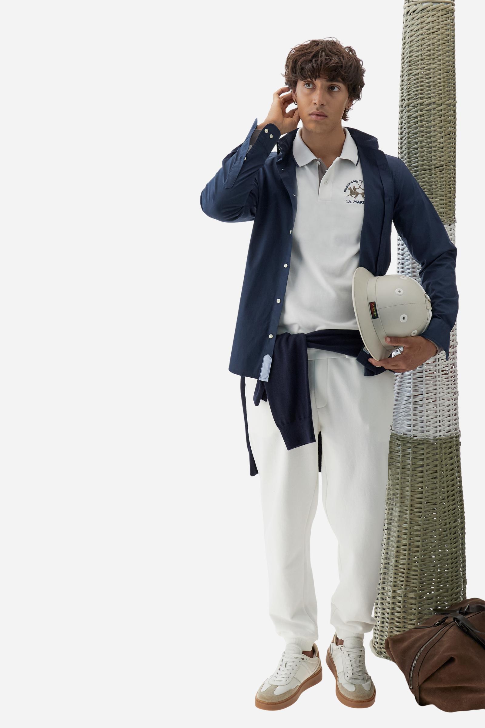 Men’s long-sleeve polo shirt in solid-colour cotton jersey with a warm, matte handfeel. Ribbed collar and cuffs with stripes and colour blocks in contrast, two personalised buttons and contrast details inside the collar. Patches and graphics on sleeves and chest celebrate the Official Polo Supplier team. The large multicolour logo is embroidered on the chest. Regular fit. The model wears size L. - Off White