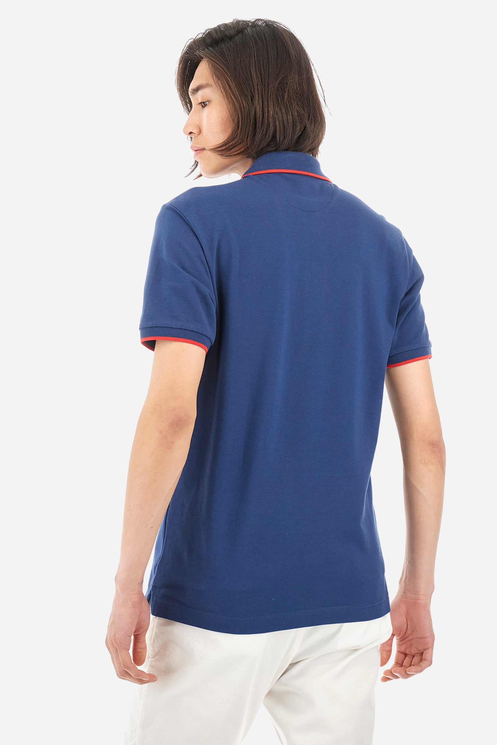 Men’s polo with short sleeves in stretch pique cotton. A classic La Martina, with a simple and linear style. The regular fit fits easily to any type of silhouette. A small La Martina logo is embroidered on the chest, in contrasting shades like the sleeve edge. The model is 187 cm tall and wears a size L. - Ensign Blue