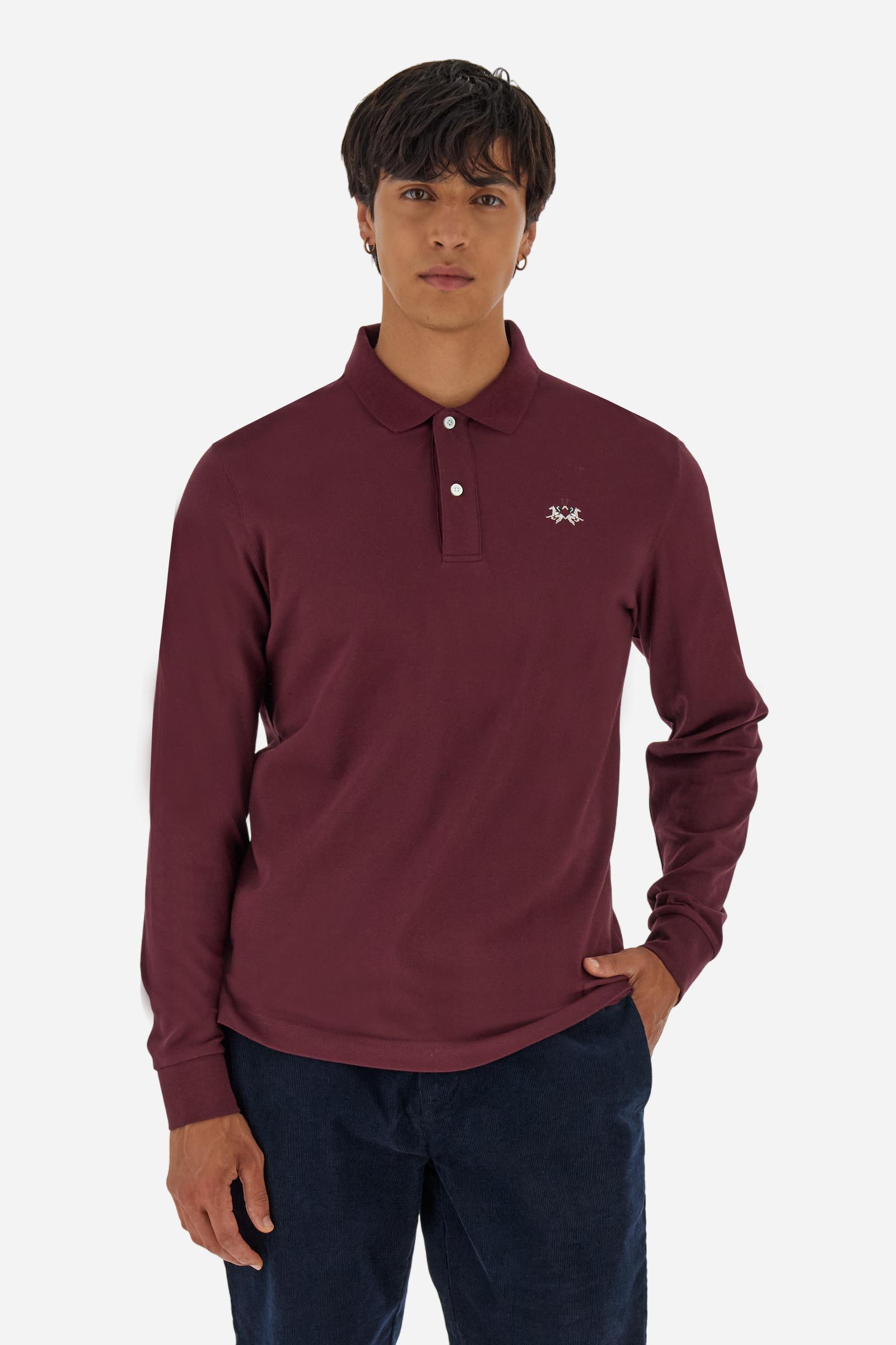 Men’s long-sleeve polo in high-quality stretch cotton piqué for comfort and flexibility. Tone-on-tone ribbed collar with contrast gabardine undercollar embroidered with the brand’s iconic lettering, revealed when the collar is lifted. Contrast embroidered logo on the chest. Slim fit, offering a modern silhouette that enhances the body while ensuring freedom of movement. Model wears size L. - Port Royale