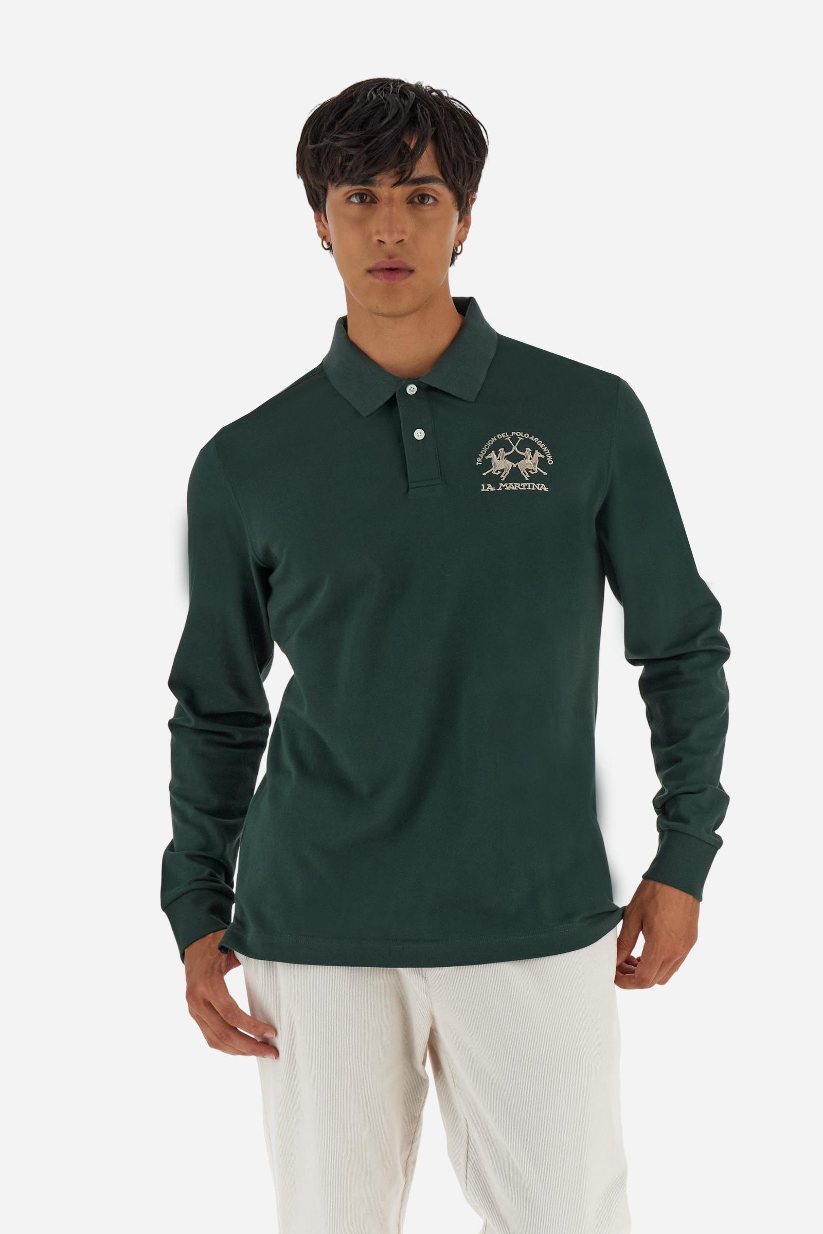 Men's long-sleeved solid colour polo shirt. Made of high-quality stretch Piqué. The collar and cuffs are in solid colour ribbing. The undercollar features a print of the iconic La Martina lettering in a contrasting colour. Featuring a logo embroidered on the chest in a contrasting colour. On the back at the bottom, the guarantee label typical of the brand's iconic models is applied. Regular fit. The model is wearing a size L. - Sycamore