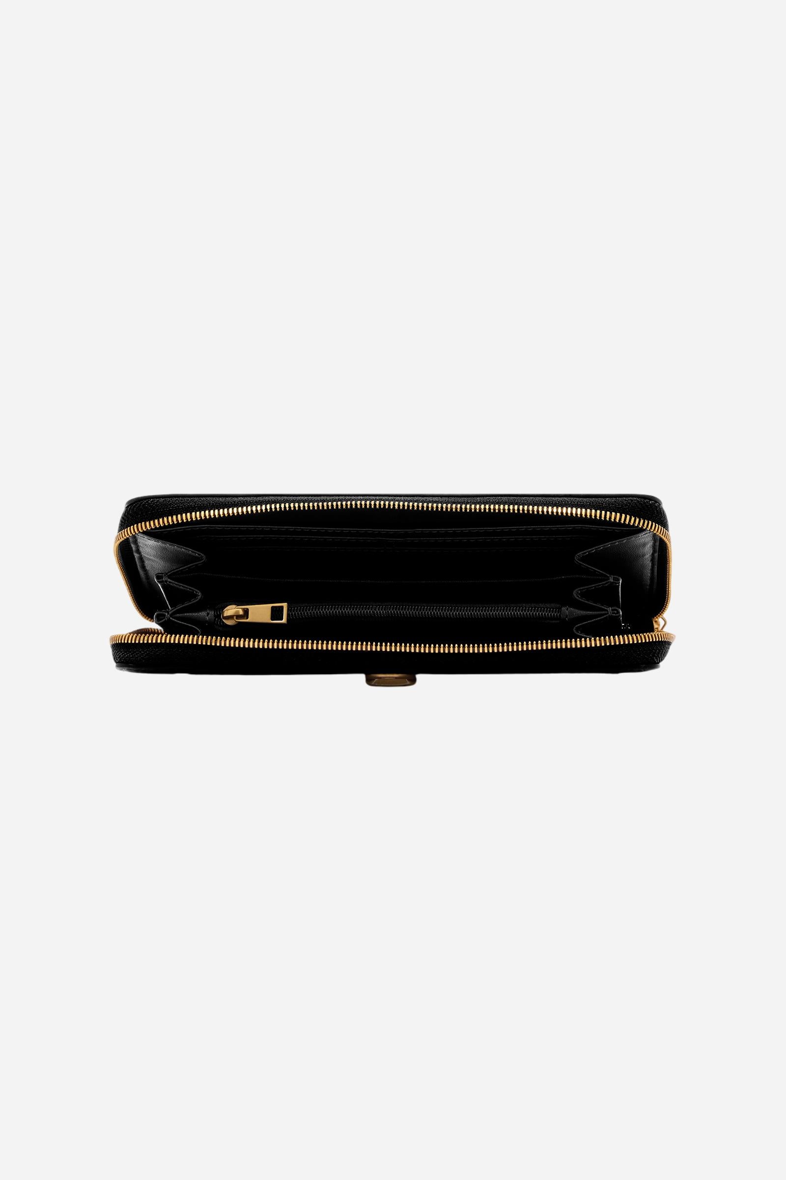 Rectangular zip-around wallet in soft, solid-colour full-grain leather. Features compartments for cards, bills, and coins. Elegant design meets everyday functio - Black