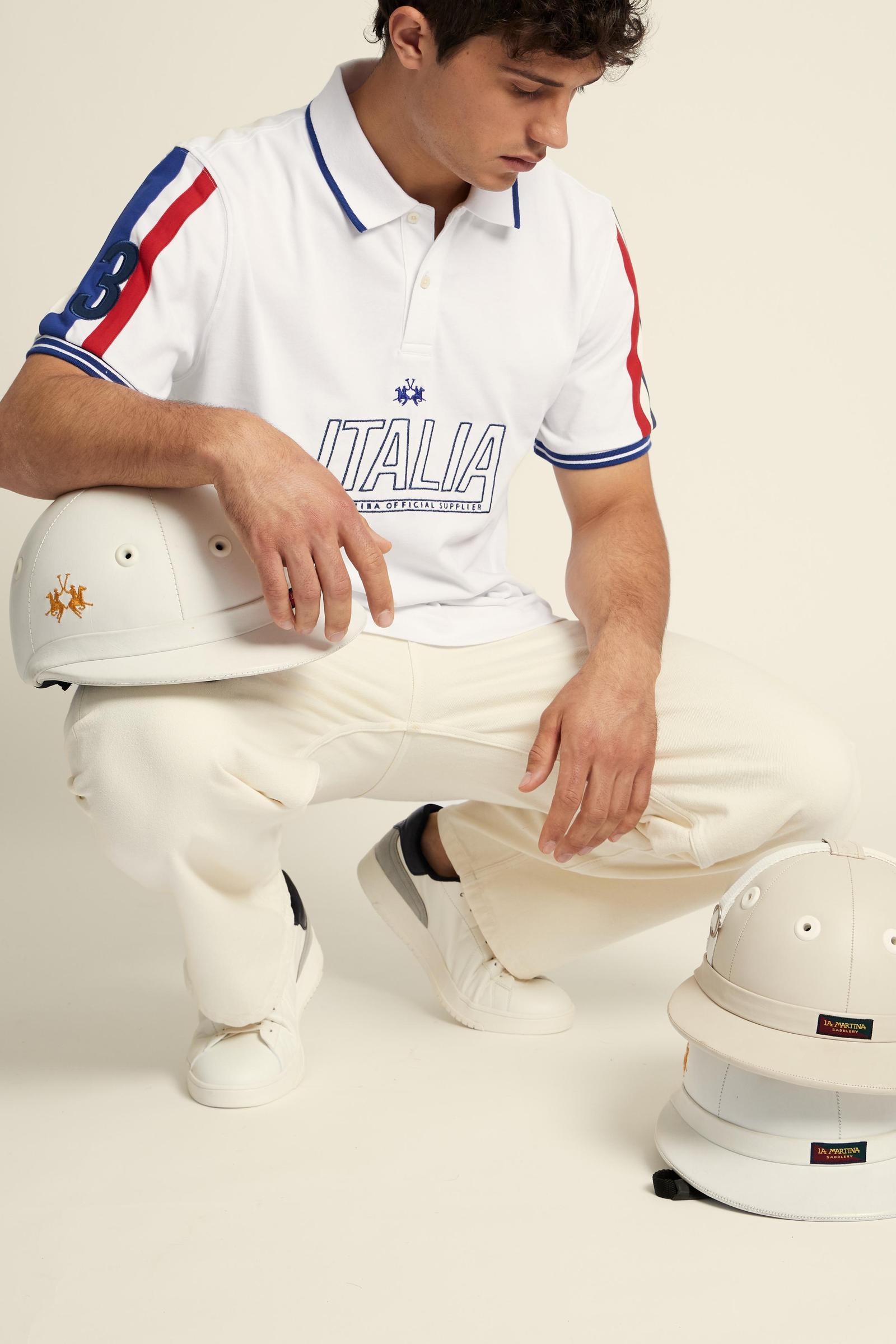 Men's short-sleeve polo in 100% cotton jersey featuring bold Italia graphics, contrast piping, and a contemporary fit. Perfect for a stylish, sporty look. - Optic White