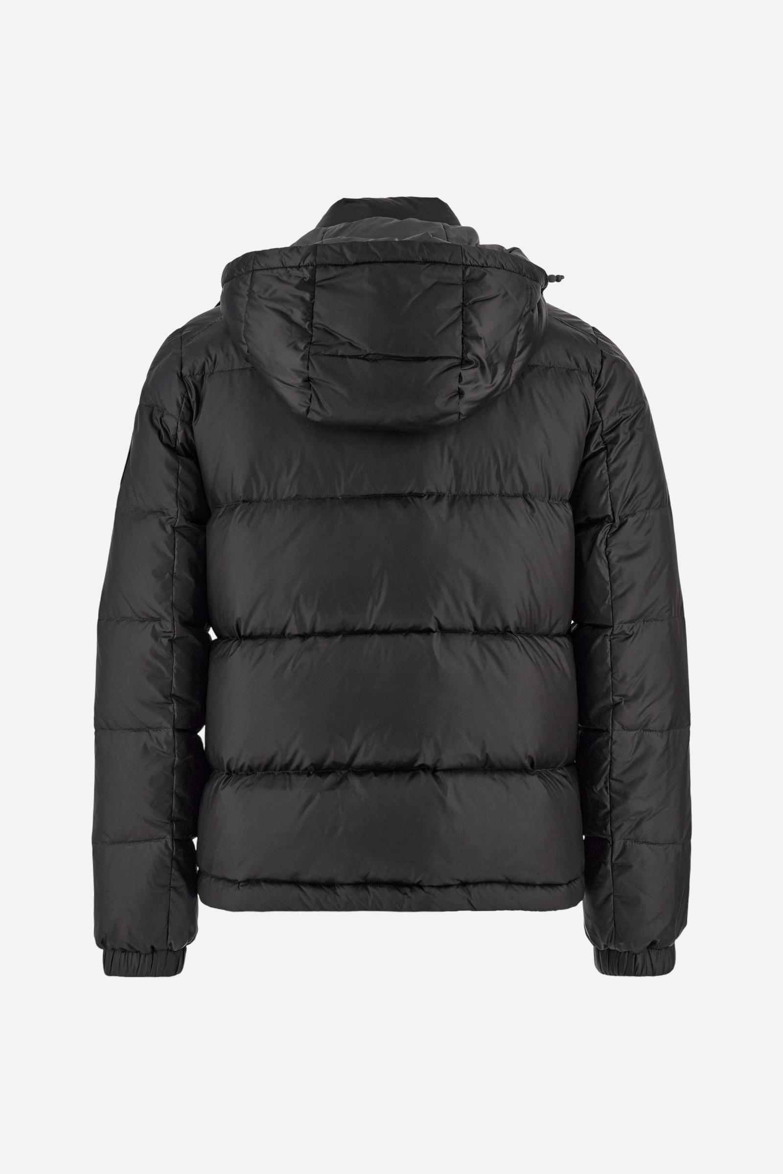 Men’s padded bomber jacket with detachable hood. Made of solid iridescent nylon with contrast lining. Equipped with two practical inner braces for extra comfort. Double customized zip front closure with inner placket featuring contrast Polo Player print, closed with metal snap buttons. Two vertical zipped pockets on the front. Hood with contrast lining and adjustable elastic drawstring. Bold Polo Player graphics printed inside. Regular fit for comfortable movement without bulk. Model wears size L. - Black