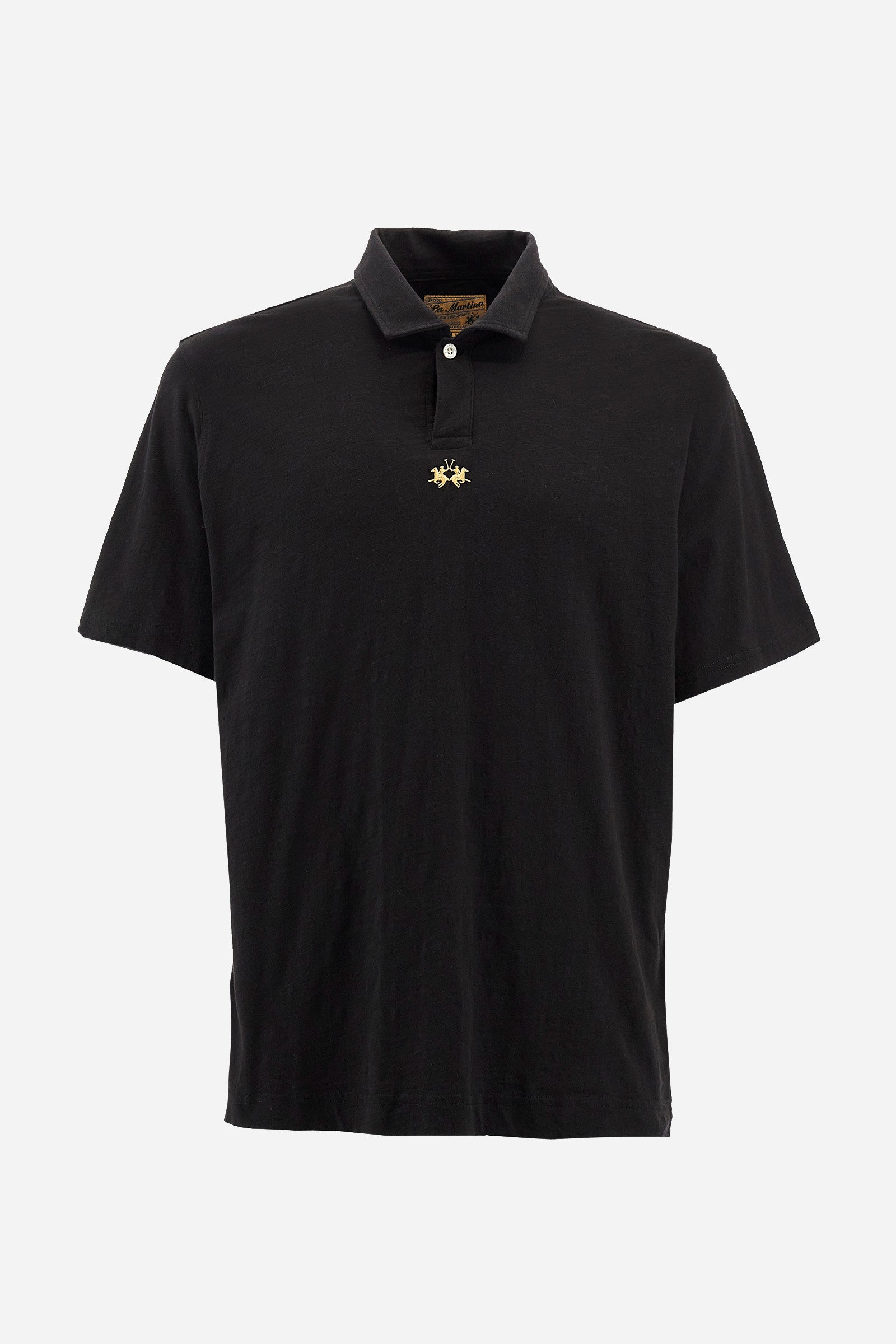 This is the iconic Polo 19-42 from La Martina. Men's short-sleeved polo shirt in solid color made of 100% slub jersey. With a regular fit, it has a collar and a double button closure while the La Martina logo is embroidered in small gold on the front under the placket. Ideal when worn with denim from the collection. Each Polo is kept in an exclusive logoed envelope and is accompanied by a certificate of guarantee. The model is 187 cm tall and wears a size L. - Black