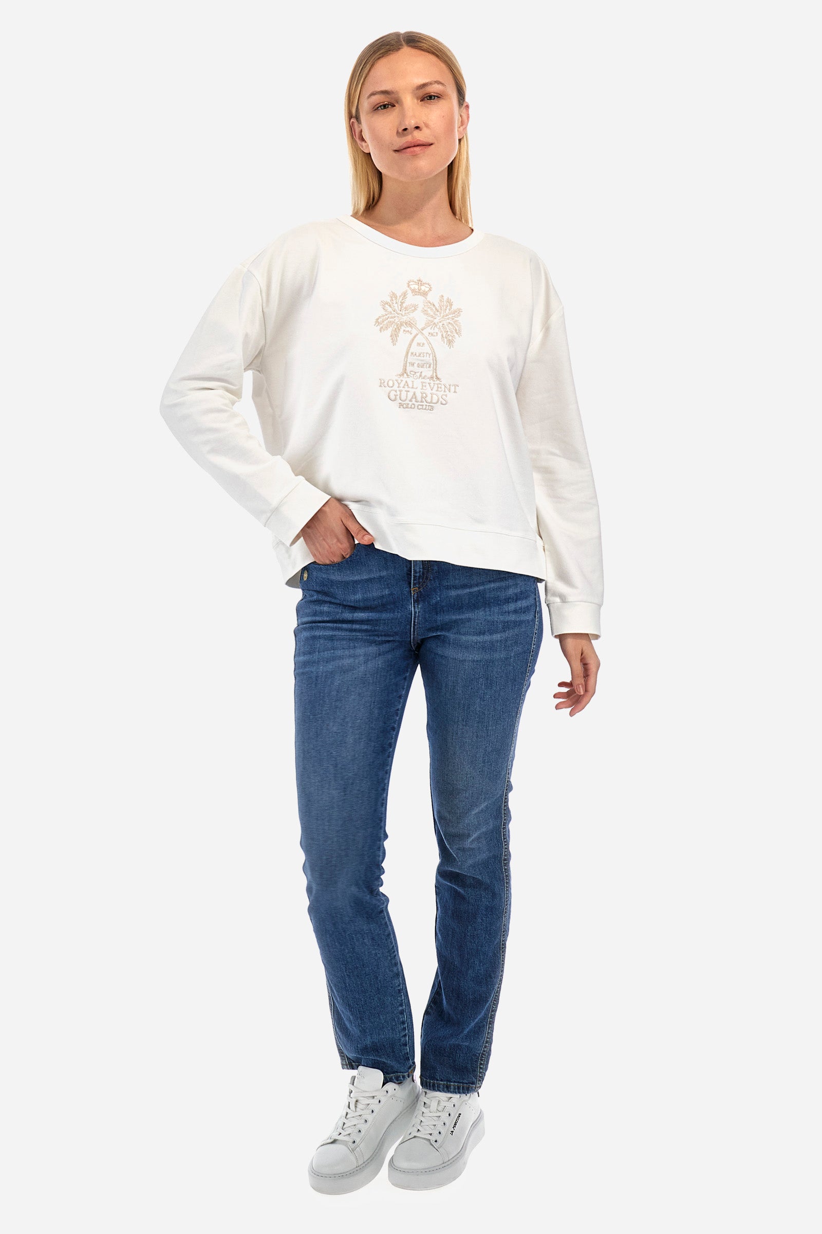 Women's long-sleeved sweatshirt with a crew neck in a single colour, in elasticated cotton. The front features embroidered palm trees and lettering. On the back there are decorative buttons. The logo is embroidered on one of the sleeves together with the symbol of a crown. The fit is regular. The model wears a size 2. - Off White