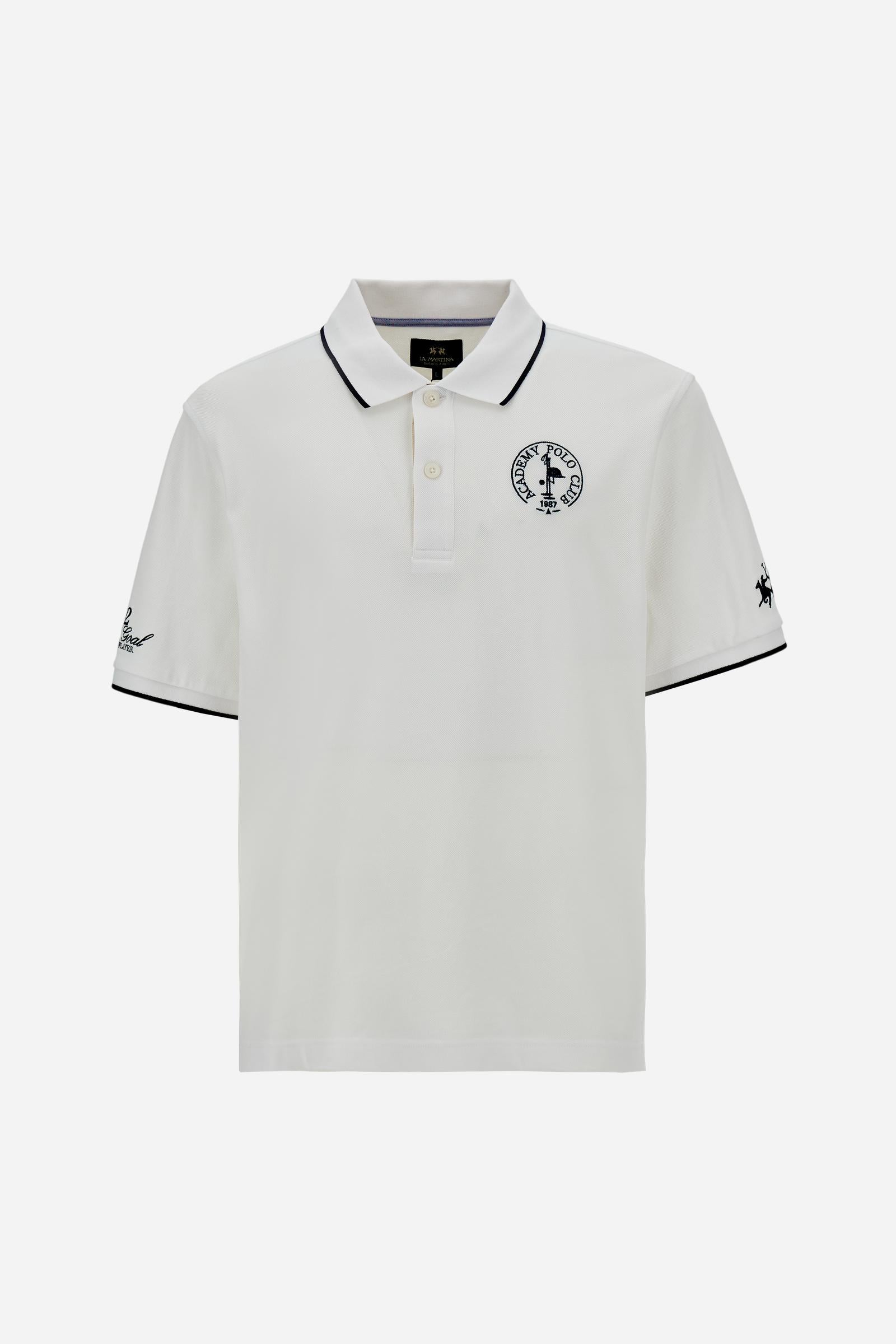 Piqué cotton polo with classic collar and contrast details. Graphic embroidery on chest and sleeves, including the “Academy Polo Club” crest. Modern clean fit. - Optic White