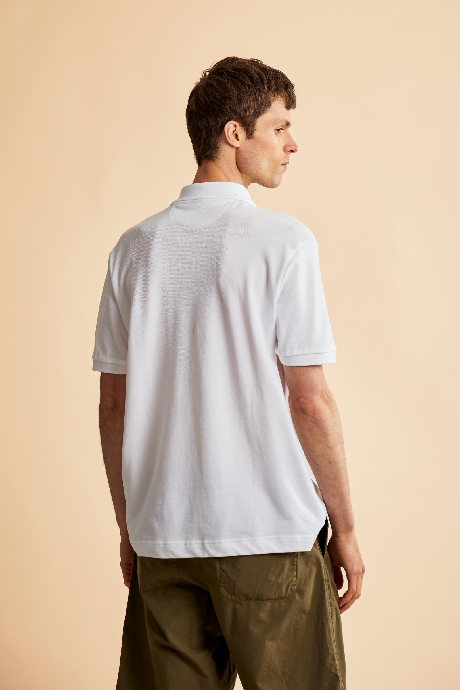 Men’s short sleeve cotton piqué polo shirt with regular fit, two-button placket and contrast brand logo. - Optic White