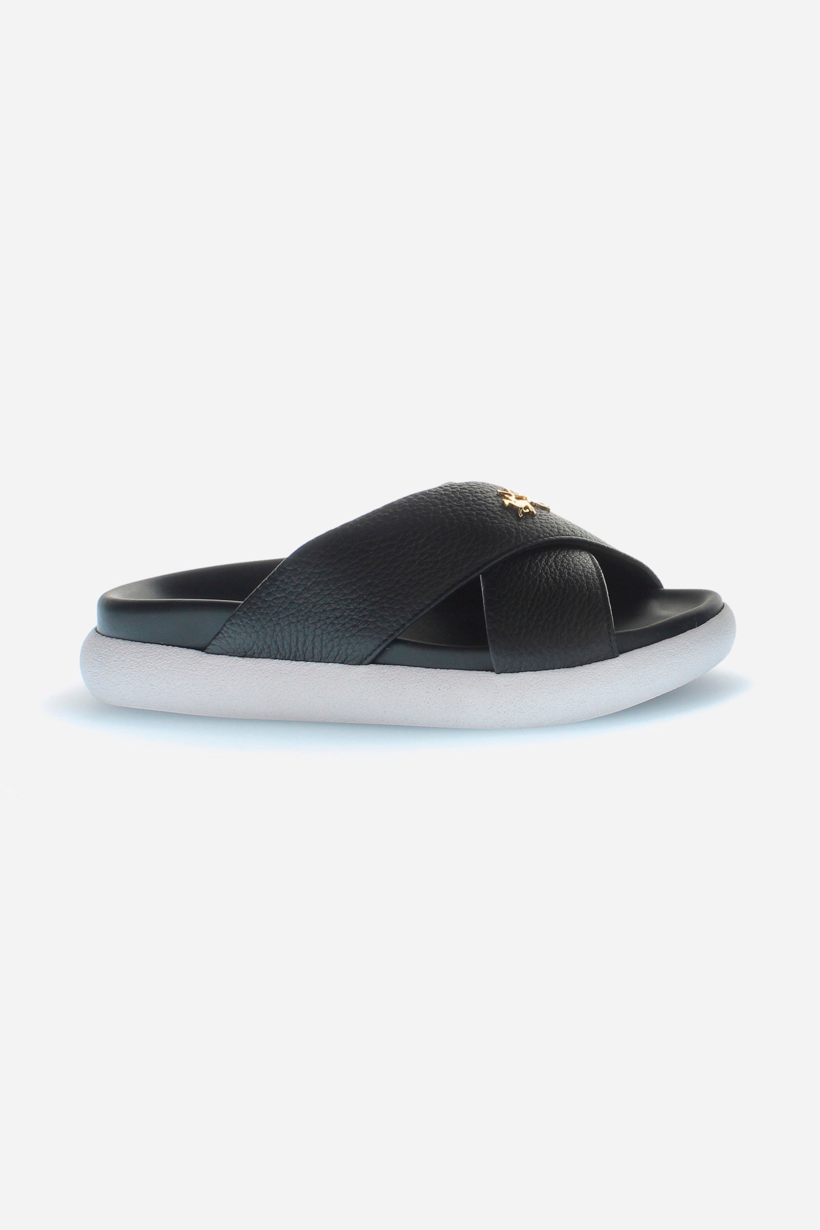 Women's sandal in soft tumbled leather, made with two wide crossed bands on the front and embellished with the La Martina figure logo in golden metal. The bottom is in non-slip and waterproof PU, which gives a comfortable and secure fit. To be combined with a summer look, to create the right mix of elegance and comfort. - BLACK