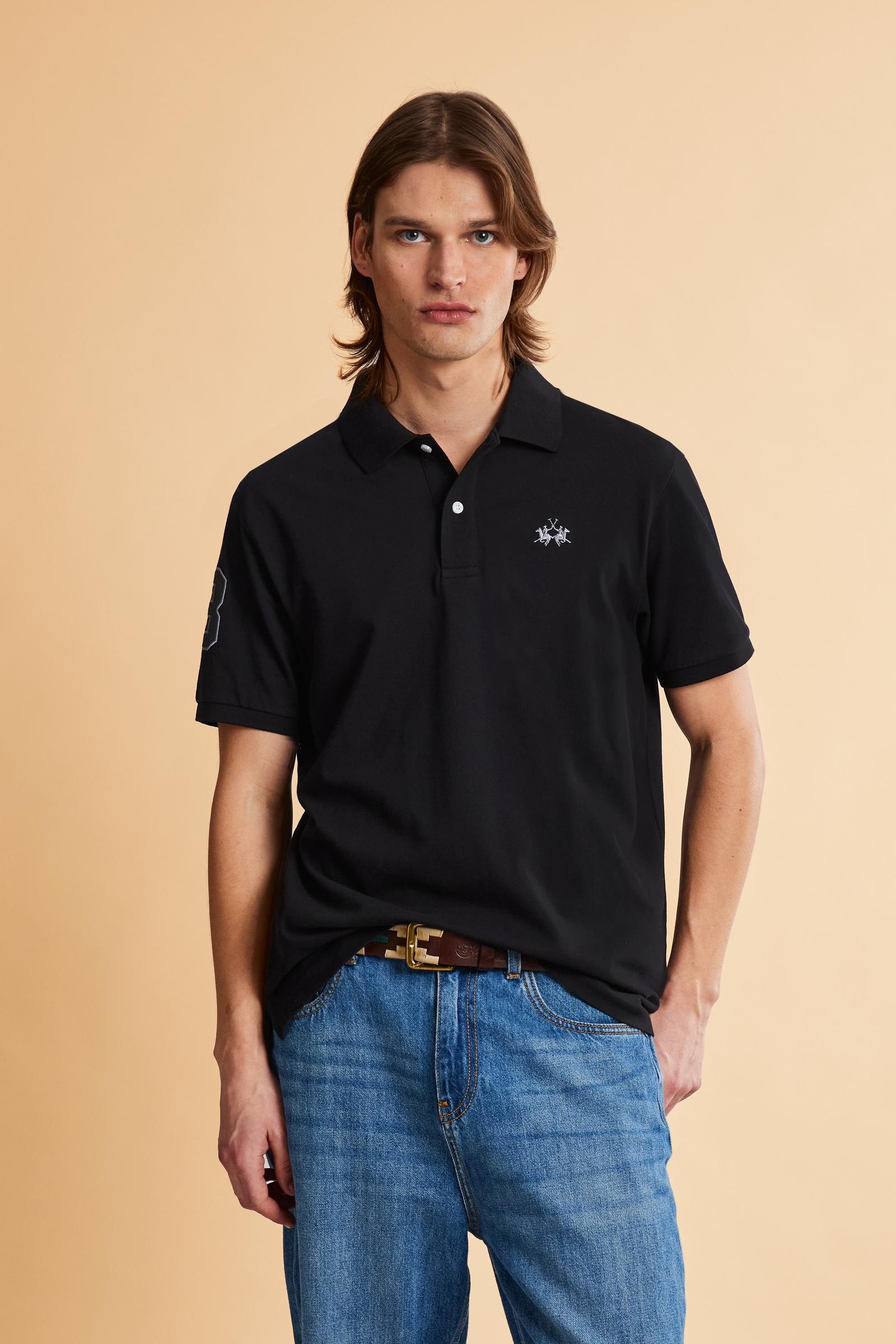 Men’s short-sleeve stretch piqué polo. Two-button placket and ribbed details, with a regular fit. Iconic style characterised by applied logo and patches. - Black