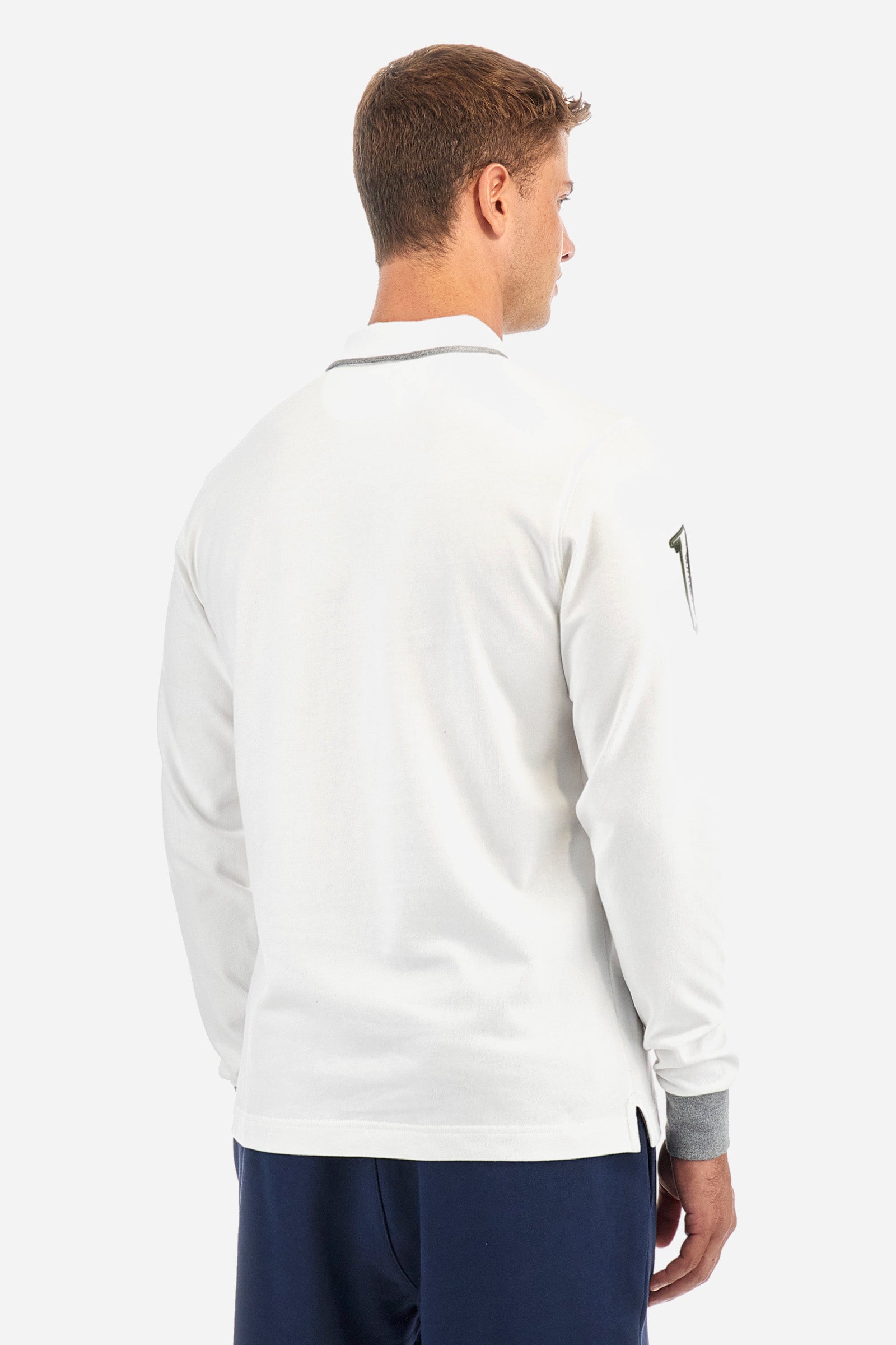 Men's single-colour long-sleeved polo shirt, made from 100% cotton. Three-button fastening. Profiled collar, with the brand's initials underneath. Colour-contrasting cuffs. The garment features all-over lettering and symbols. The logo is embroidered on the front. Regular fit. The model is wearing a size L. - Off White