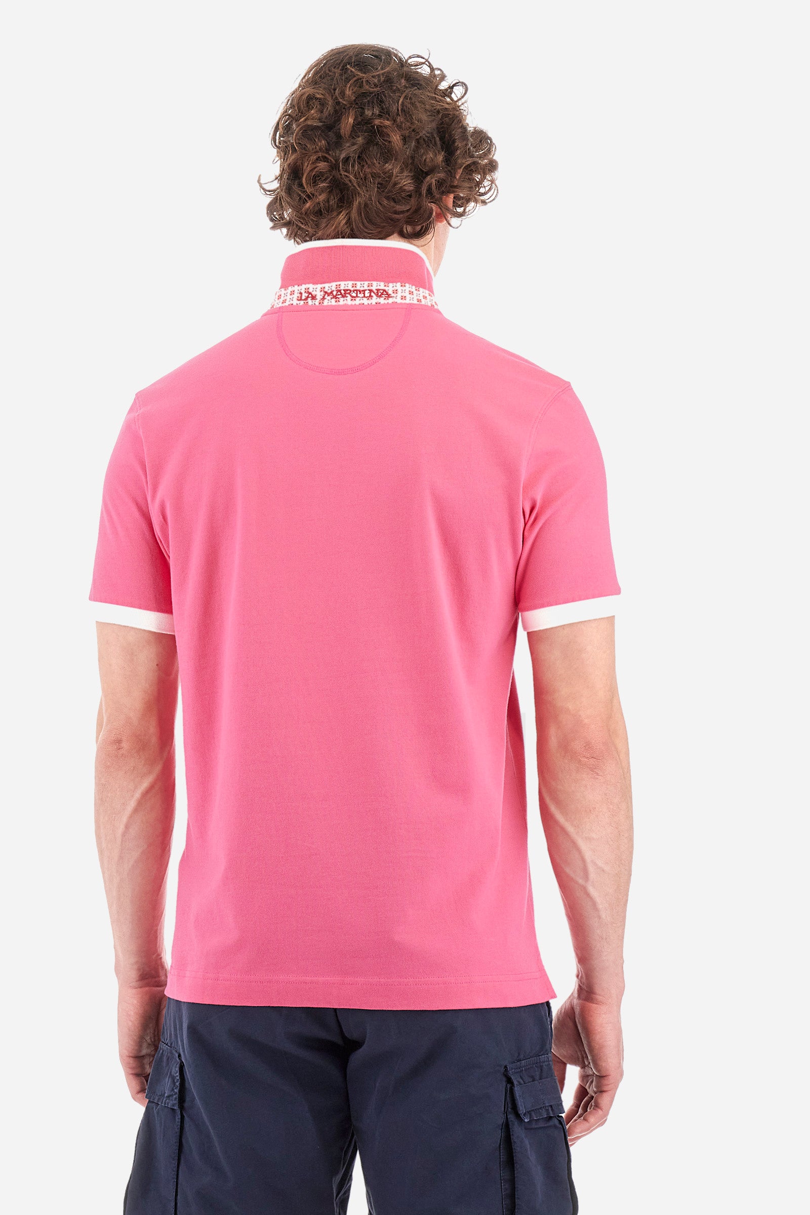 Men's short-sleeved single-colour polo shirt in elasticated cotton. Two-button fastening. With a profiled and ribbed collar and armholes. On the chest we find stylised waves with lettering. The back of the collar features the "La Martina" lettering. The logo is embroidered on the front. The fit is regular. The model wears a size L. - Hot Pink