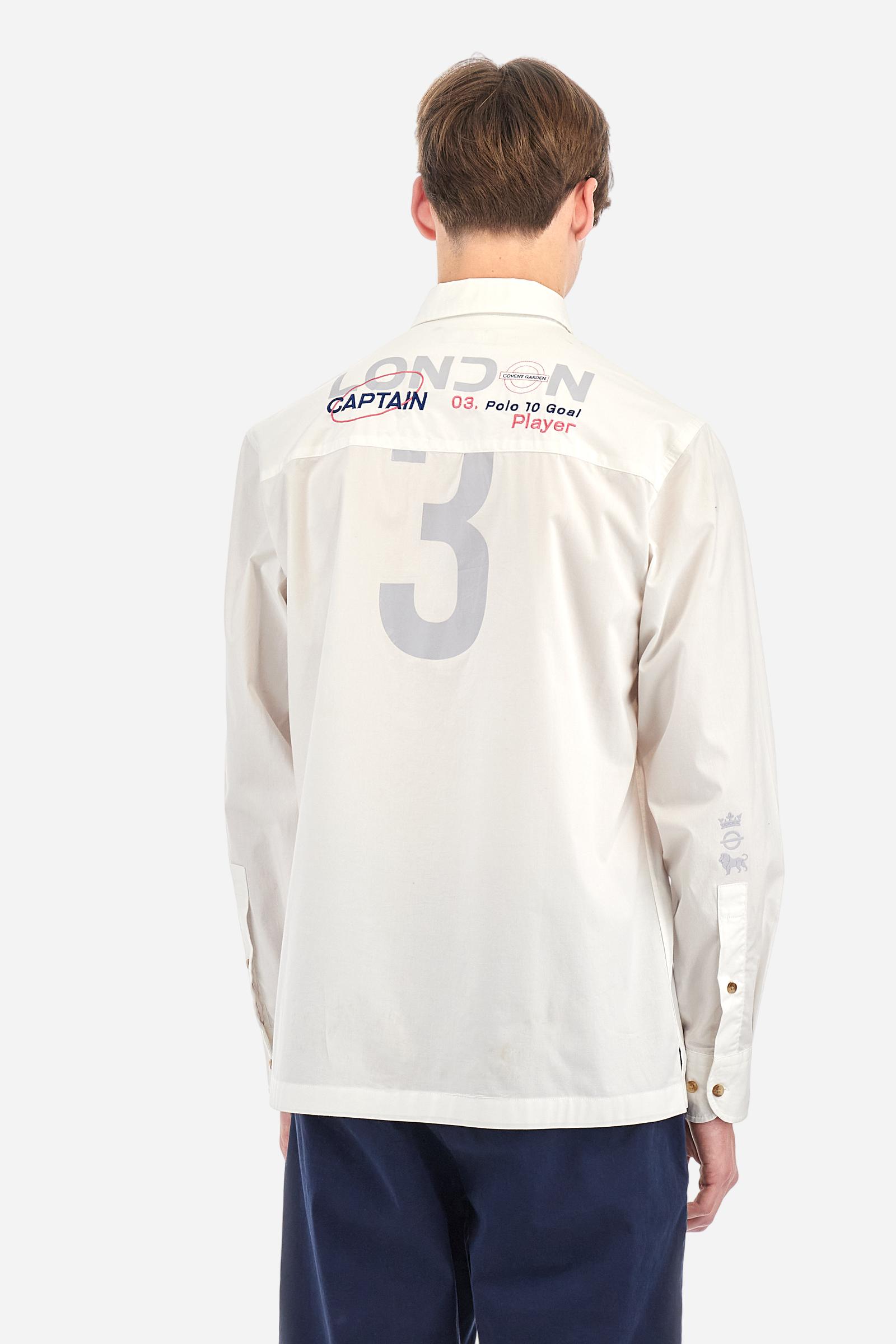 Men's single-colour long-sleeved shirt, made from 100% cotton poplin. Spread collar. Contrasting printed fabric details on the inside of the collar and opening. The numbers on the chest and back graphics are rubberised prints, while the rest of the graphics are embroidered. The logo and La Martina lettering is embroidered on the left chest. The fit is regular. The model is wearing a size L. - Optic White
