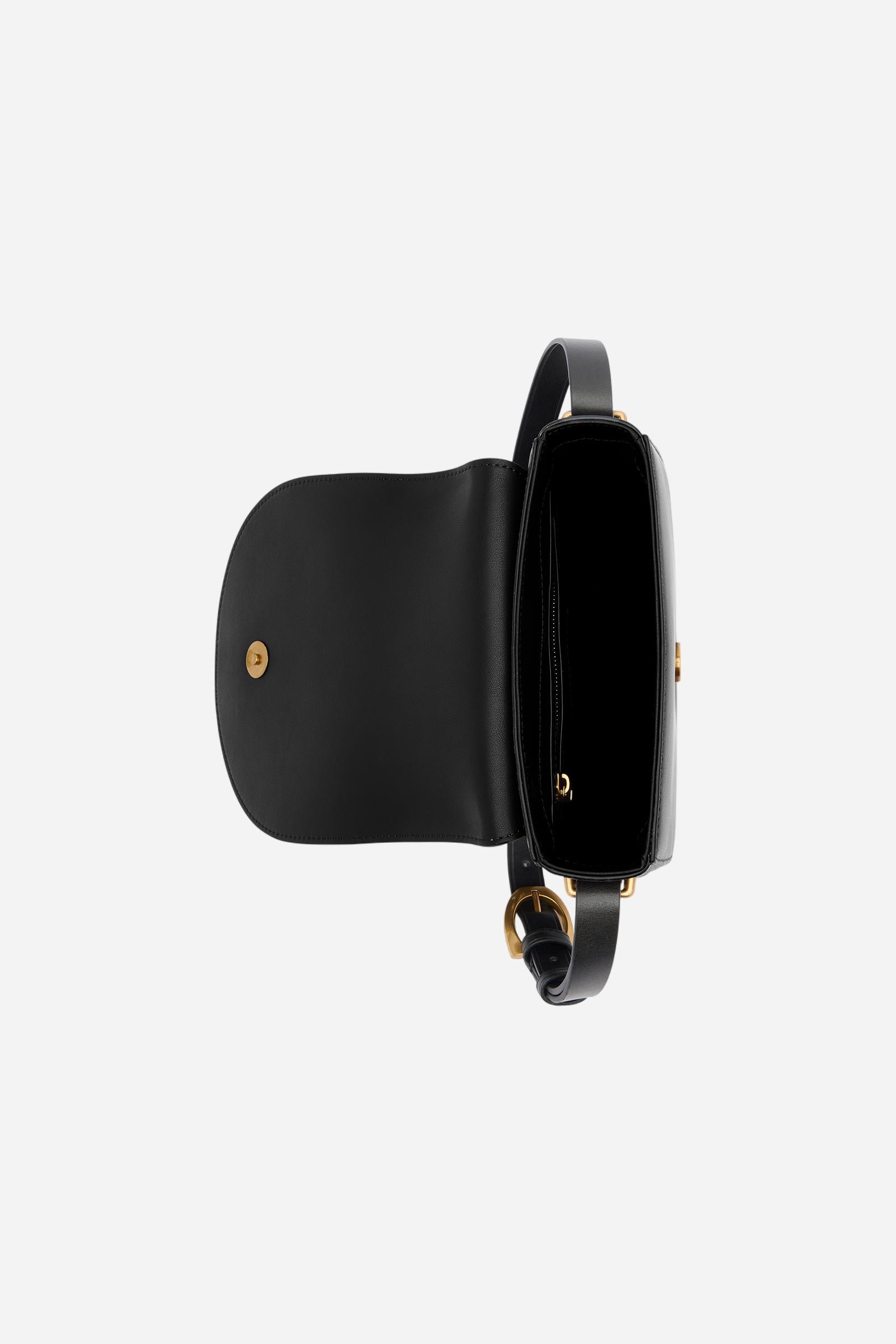 Crossbody bag in calfskin leather with curved design. Finished with flap, large golden buckle and contrasting leather details. - Black