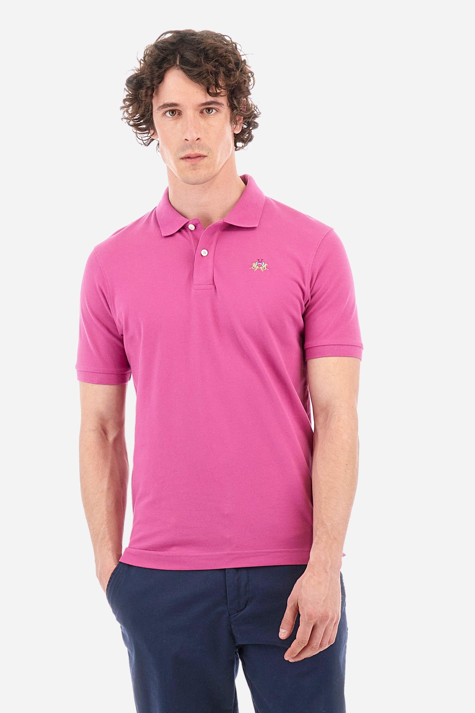 Men's single-colour short-sleeved polo in elasticated cotton. Two-button fastening. Tone-on-tone stitching. Ribbed collar and armholes. The "La Martina" lettering can be found under the collar. Featuring a small logo embroidered on the chest. In a slim fit. The model wears a size L. - Purple Wine