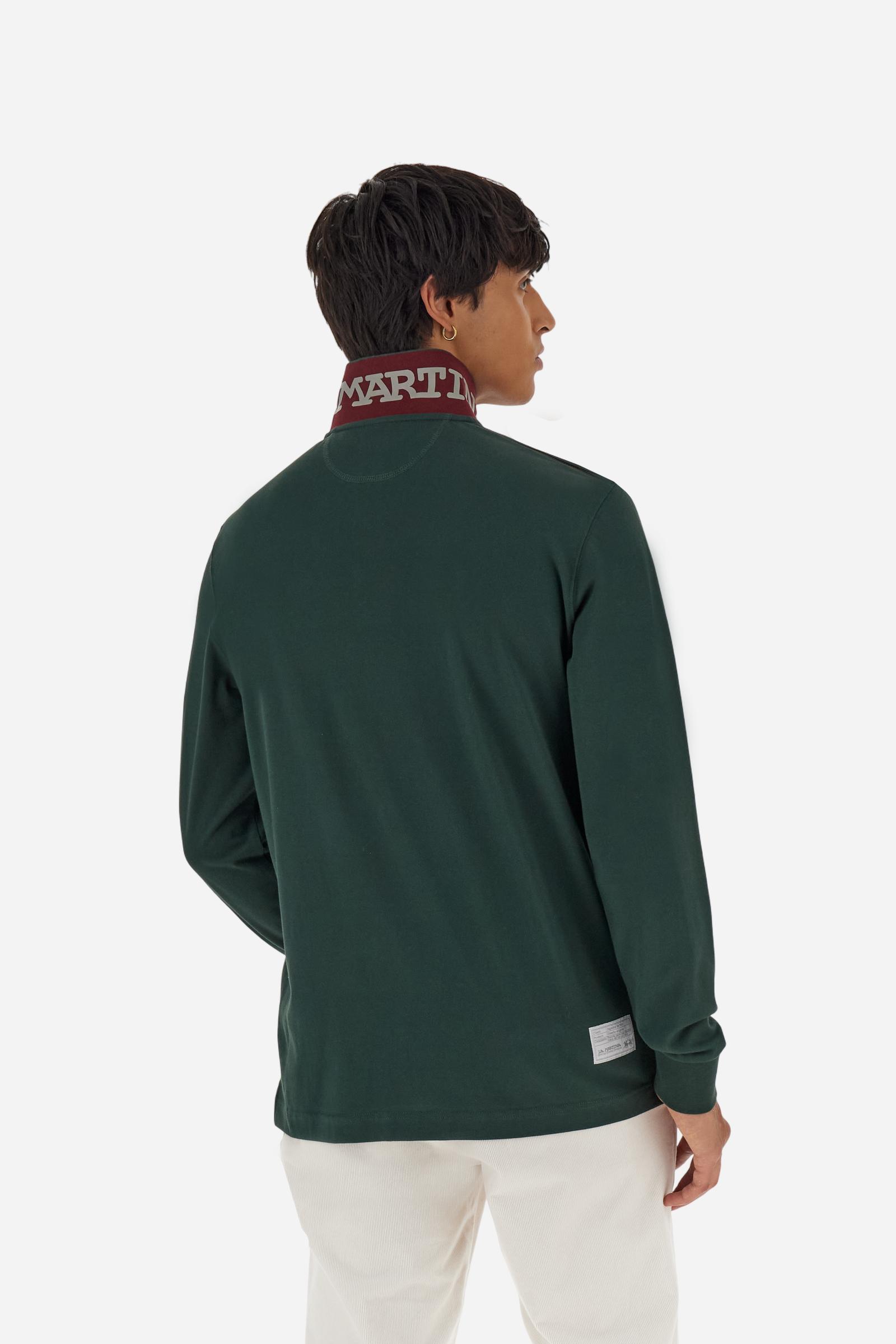 Men's long-sleeved solid colour polo shirt. Made of high-quality stretch Piqué. The collar and cuffs are in solid colour ribbing. The undercollar features a print of the iconic La Martina lettering in a contrasting colour. Featuring a logo embroidered on the chest in a contrasting colour. On the back at the bottom, the guarantee label typical of the brand's iconic models is applied. Regular fit. The model is wearing a size L. - Sycamore