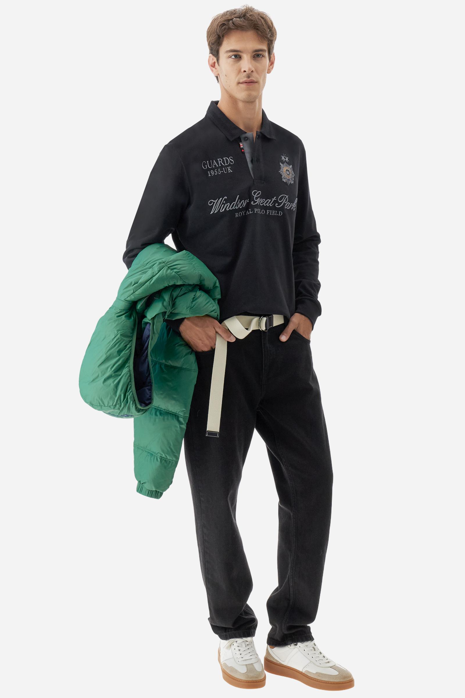 Long-sleeve polo shirt in warm cotton jersey. Ribbed collar with subtle textured detail, contrast undercollar and placket. Logo and Guards crest embroidered in contrast on the chest, paired with raised embroidered lettering inspired by Windsor tradition and British polo. Regular fit for an elegant yet relaxed style. Model wears size L. - Black