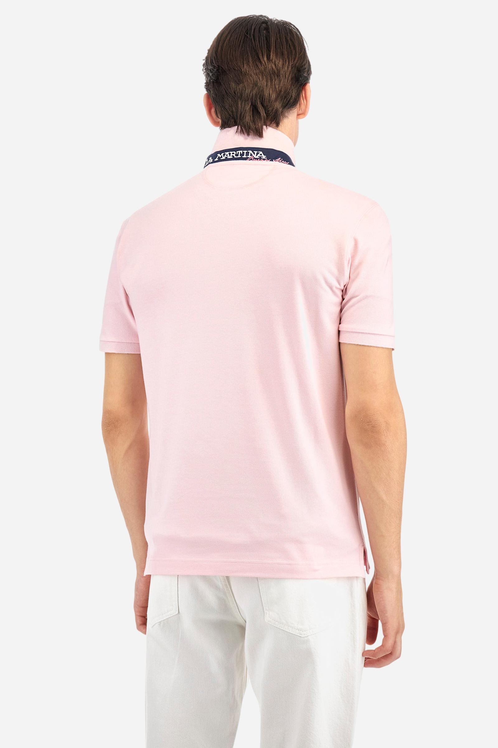 Men's plain short-sleeved polo shirt made from stretch piqué. Two-button fastening. The collar and cuffs are made from tone-on-tone ribbed fabric. Under the collar, there is a contrasting fabric panel with embroidered multicoloured lettering. The logo is embroidered on the left side of the chest in contrasting thread. Slim fit. The model is wearing a size L. - Parfait Pink