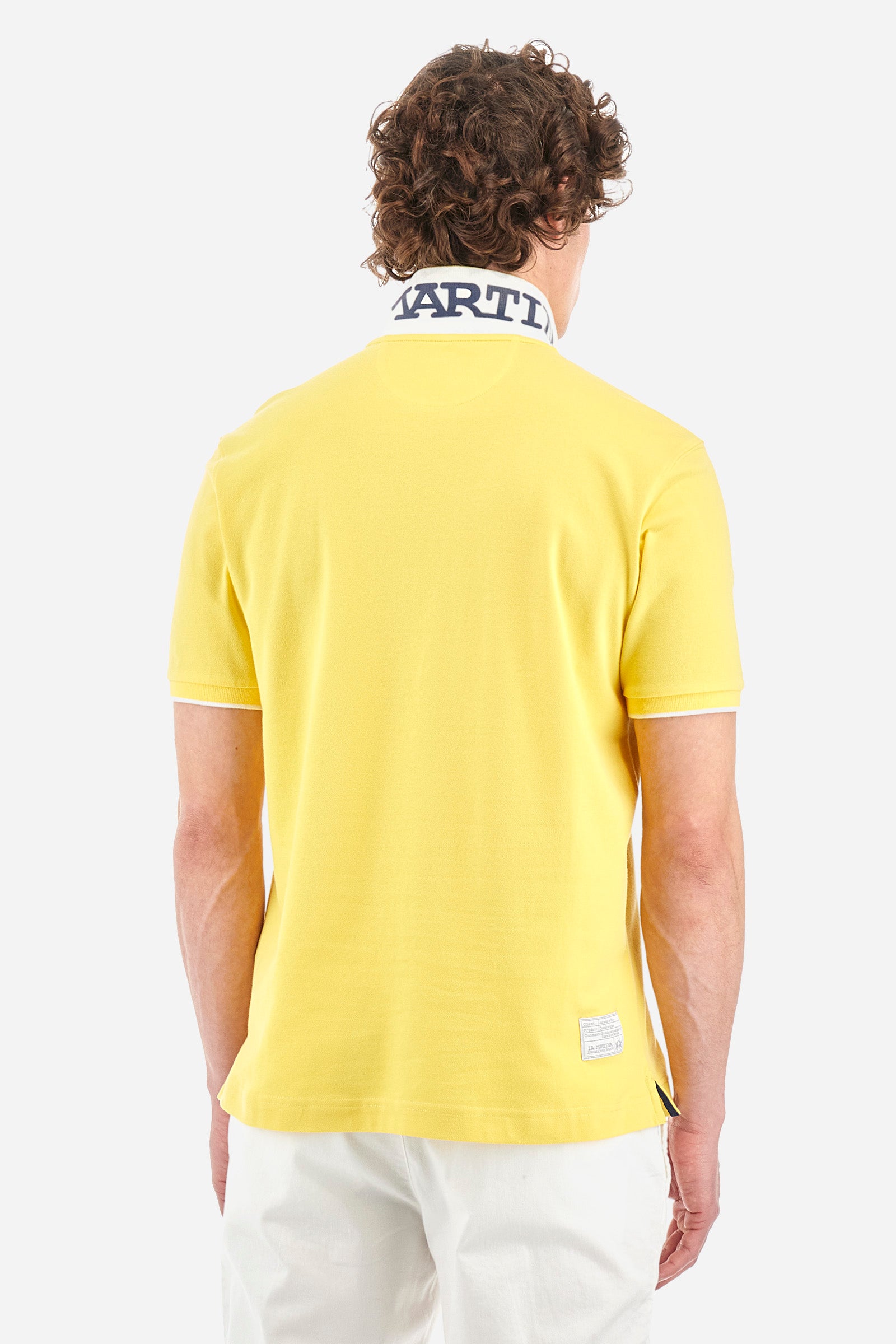 Men’s polo with short sleeves, regular fit. Made of stretch pique cotton. Classic model, with large embroidered logo in contrasting tone on the chest and profiled sleeve edges. The collar is accompanied by the writing La Martina, in contrasting tone. Ideal if worn with a denim collection. The model wears a size L. - Aspen Gold