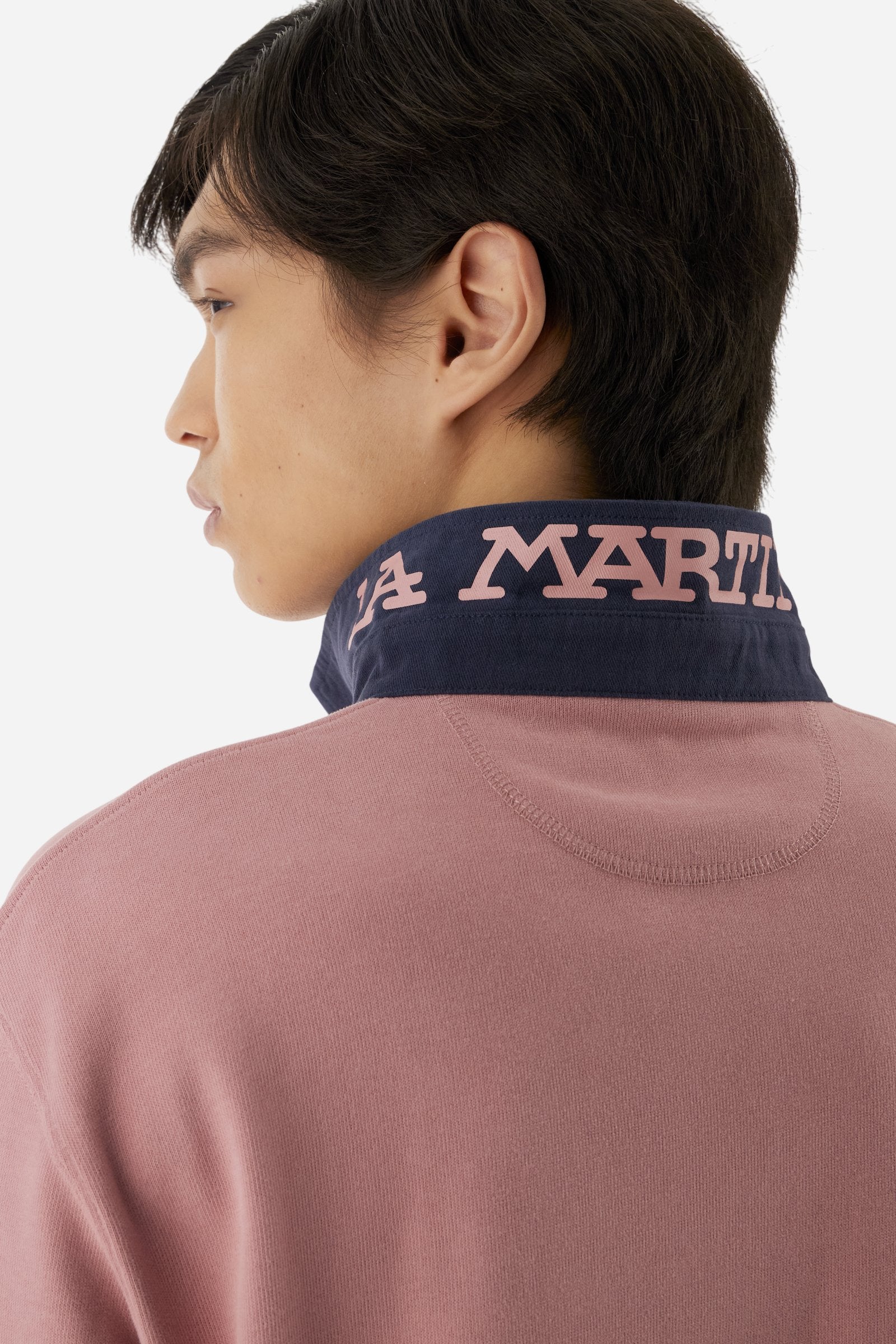 Classic men’s long-sleeve polo in soft-touch 100% cotton jersey. Contrast gabardine collar, three-button placket with multicolor striped tape. Iconic La Martina lettering printed in contrast under the collar. Small contrast logo embroidered on the chest. Regular fit for a balanced silhouette. Model wears size L. - Rose Tan