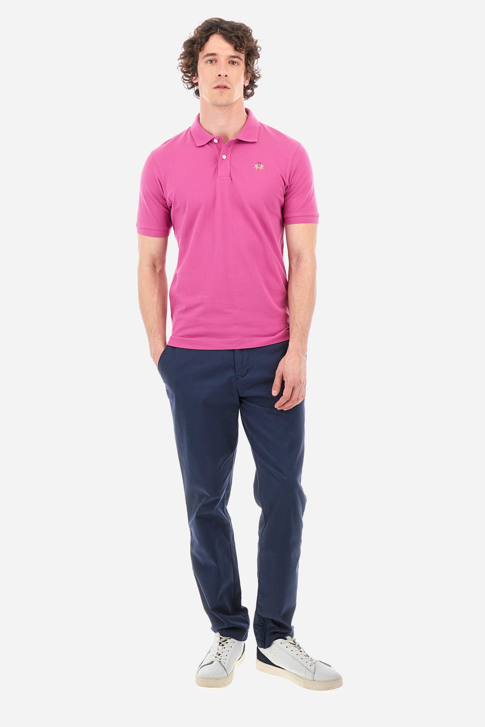 Men's single-colour short-sleeved polo in elasticated cotton. Two-button fastening. Tone-on-tone stitching. Ribbed collar and armholes. The "La Martina" lettering can be found under the collar. Featuring a small logo embroidered on the chest. In a slim fit. The model wears a size L. - Purple Wine