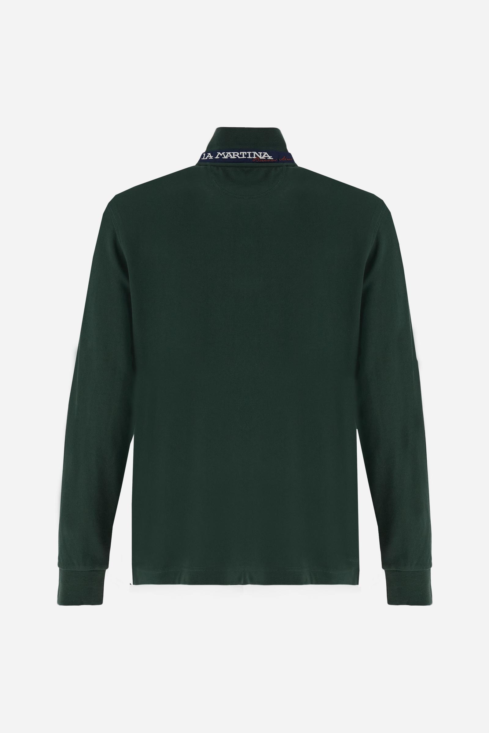 Men’s long-sleeve polo in high-quality stretch cotton piqué for comfort and flexibility. Tone-on-tone ribbed collar with contrast gabardine undercollar embroidered with the brand’s iconic lettering, revealed when the collar is lifted. Contrast embroidered logo on the chest. Slim fit, offering a modern silhouette that enhances the body while ensuring freedom of movement. Model wears size L. - Sycamore