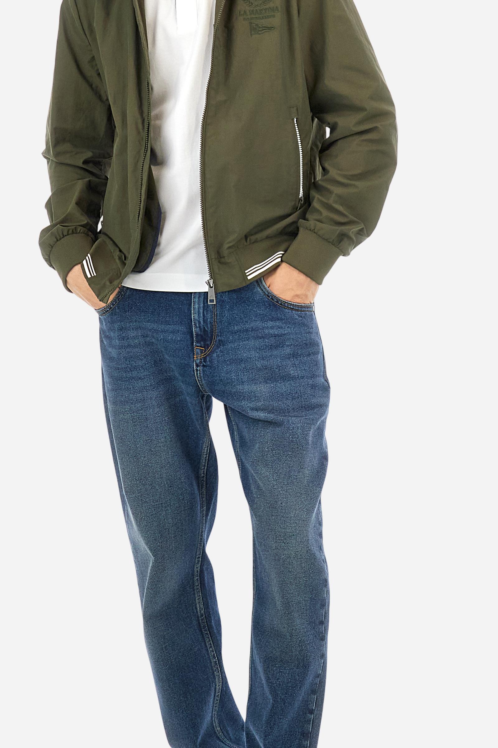 Short-sleeved, single-colour men's polo shirt made of stretch cotton piqué. Fastens with two buttons and internal opening, button side, in contrasting fabric. Ribbed collar and cuffs. The cuffs feature an inlaid detail in a contrasting colour. The graphics on the chest and back are made with mixed techniques: printing and embroidery. The logo is embroidered on the chest, left side. The fit is regular. The model is wearing a size L. - Optic White