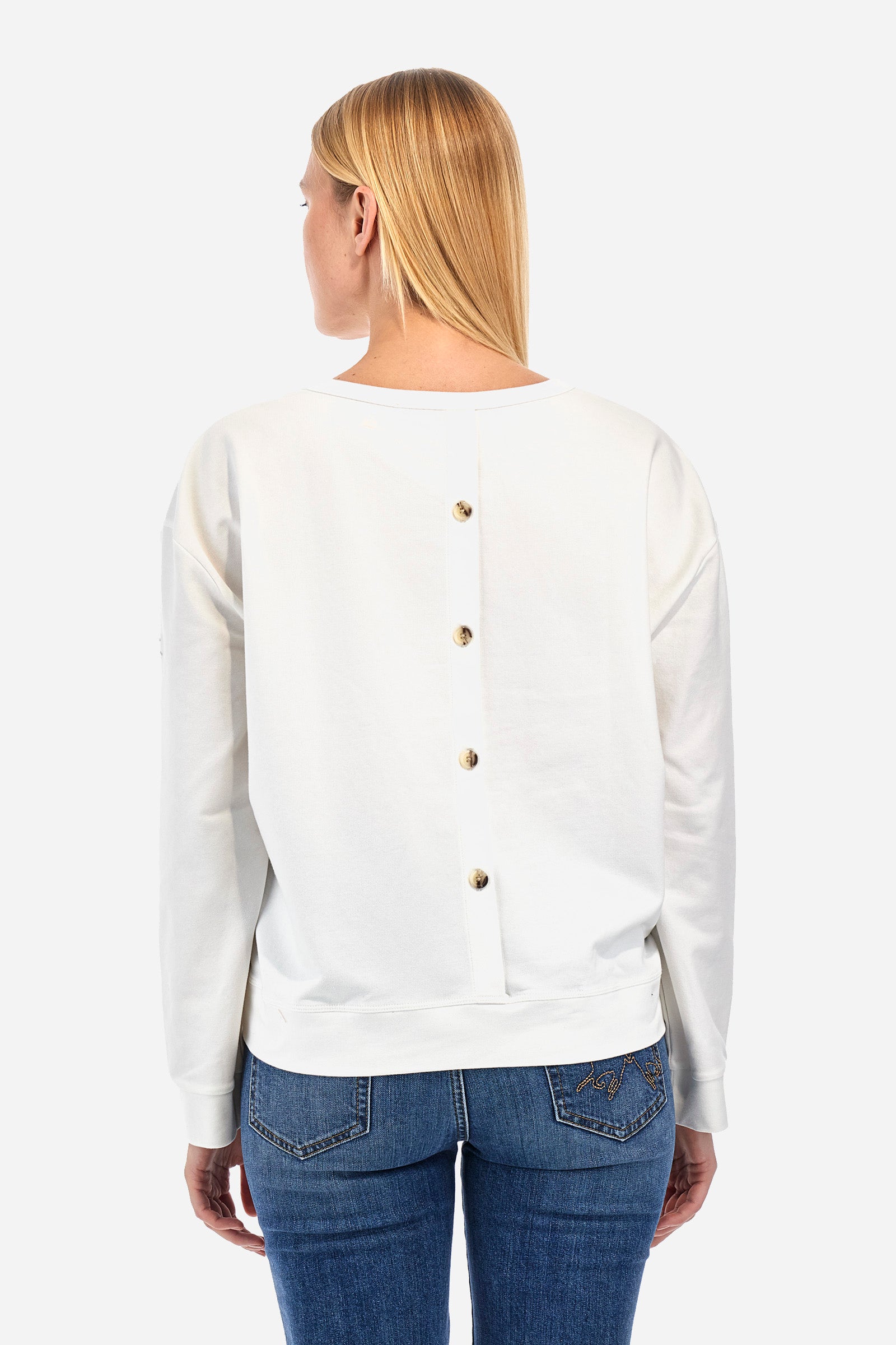 Women's long-sleeved sweatshirt with a crew neck in a single colour, in elasticated cotton. The front features embroidered palm trees and lettering. On the back there are decorative buttons. The logo is embroidered on one of the sleeves together with the symbol of a crown. The fit is regular. The model wears a size 2. - Off White