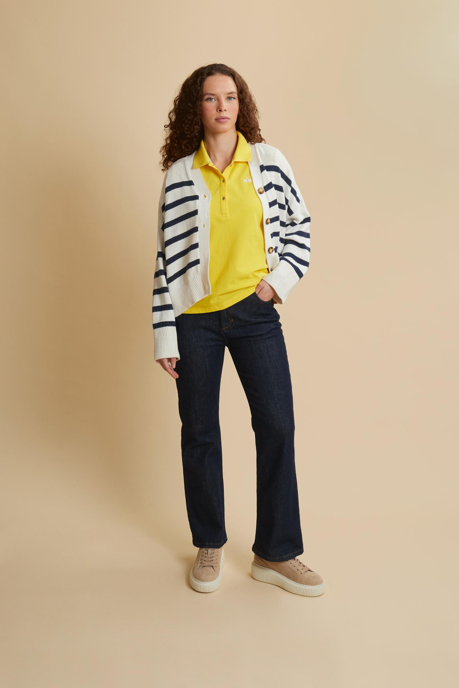 Women’s short-sleeve polo in stretch piqué. Updated regular fit for a more contemporary silhouette. Ribbed collar and cuffs in matching tone, small placket with custom buttons. Brand lettering printed in contrast under the collar and small embroidered logo on the chest. The model wears size 2. - Empire Yellow