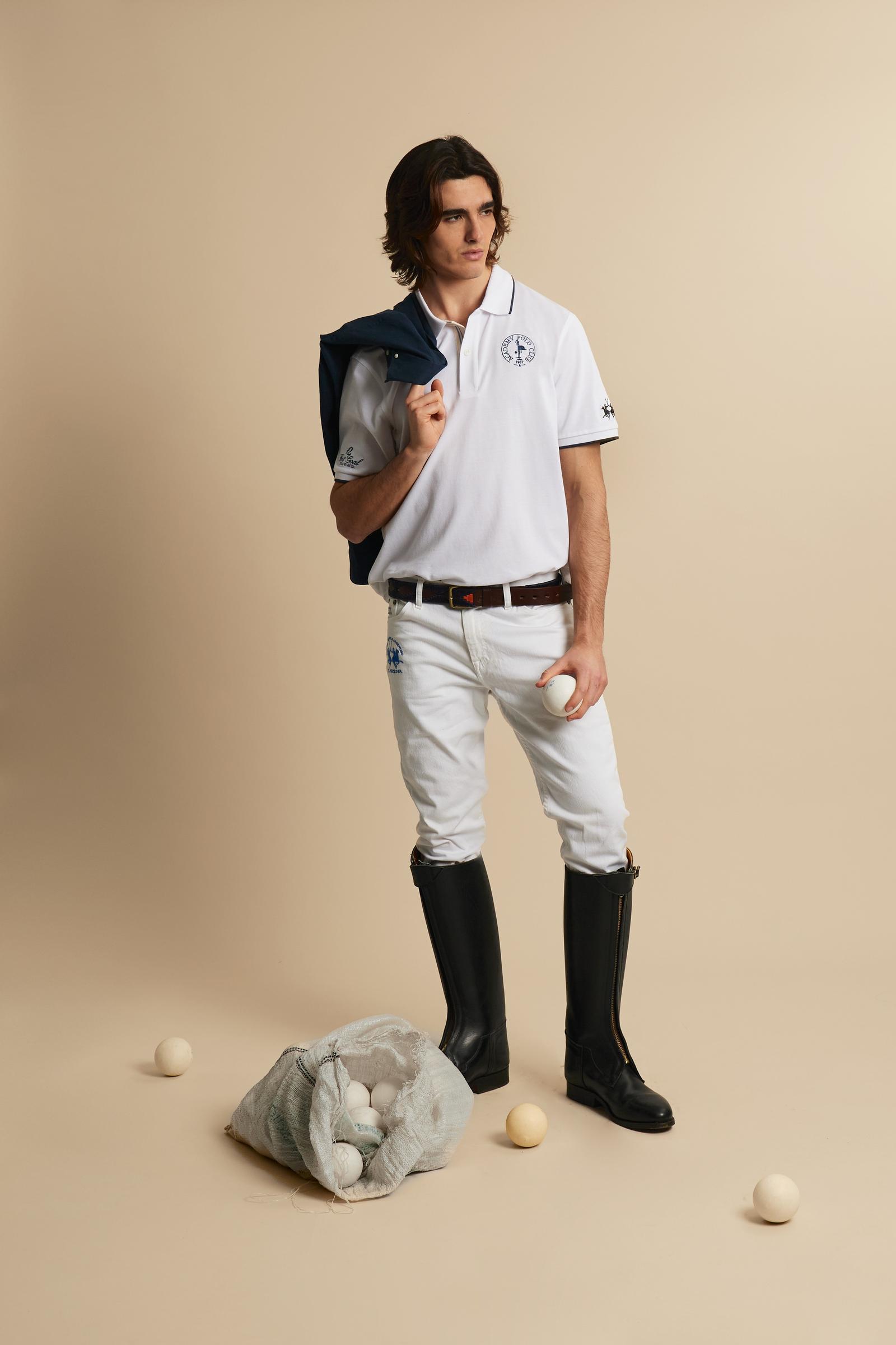 Piqué cotton polo with classic collar and contrast details. Graphic embroidery on chest and sleeves, including the “Academy Polo Club” crest. Modern clean fit. - Optic White