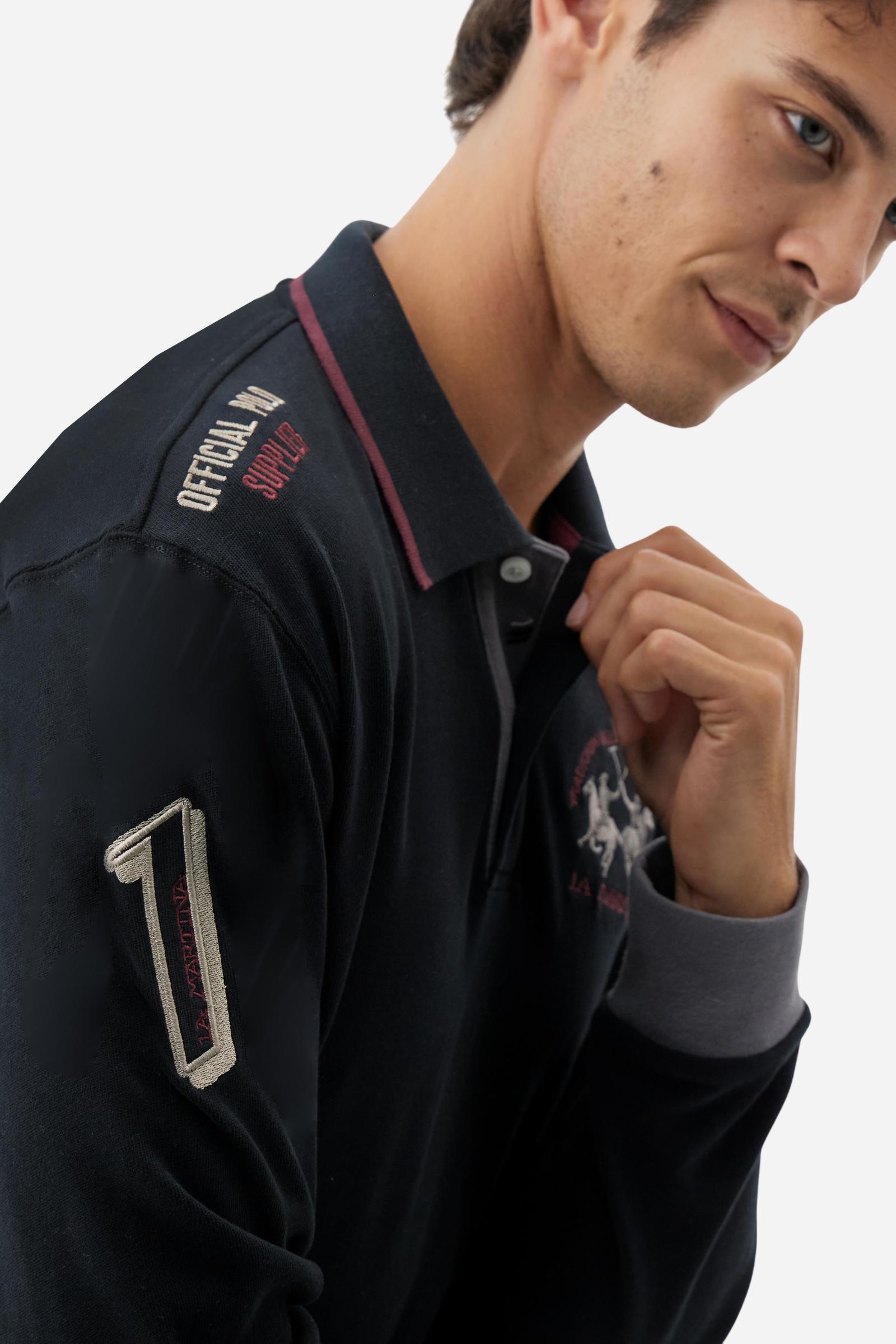 Men’s long-sleeve polo shirt in solid-colour cotton jersey with a warm, matte handfeel. Ribbed collar and cuffs with stripes and colour blocks in contrast, two personalised buttons and contrast details inside the collar. Patches and graphics on sleeves and chest celebrate the Official Polo Supplier team. The large multicolour logo is embroidered on the chest. Regular fit. The model wears size L. - Black