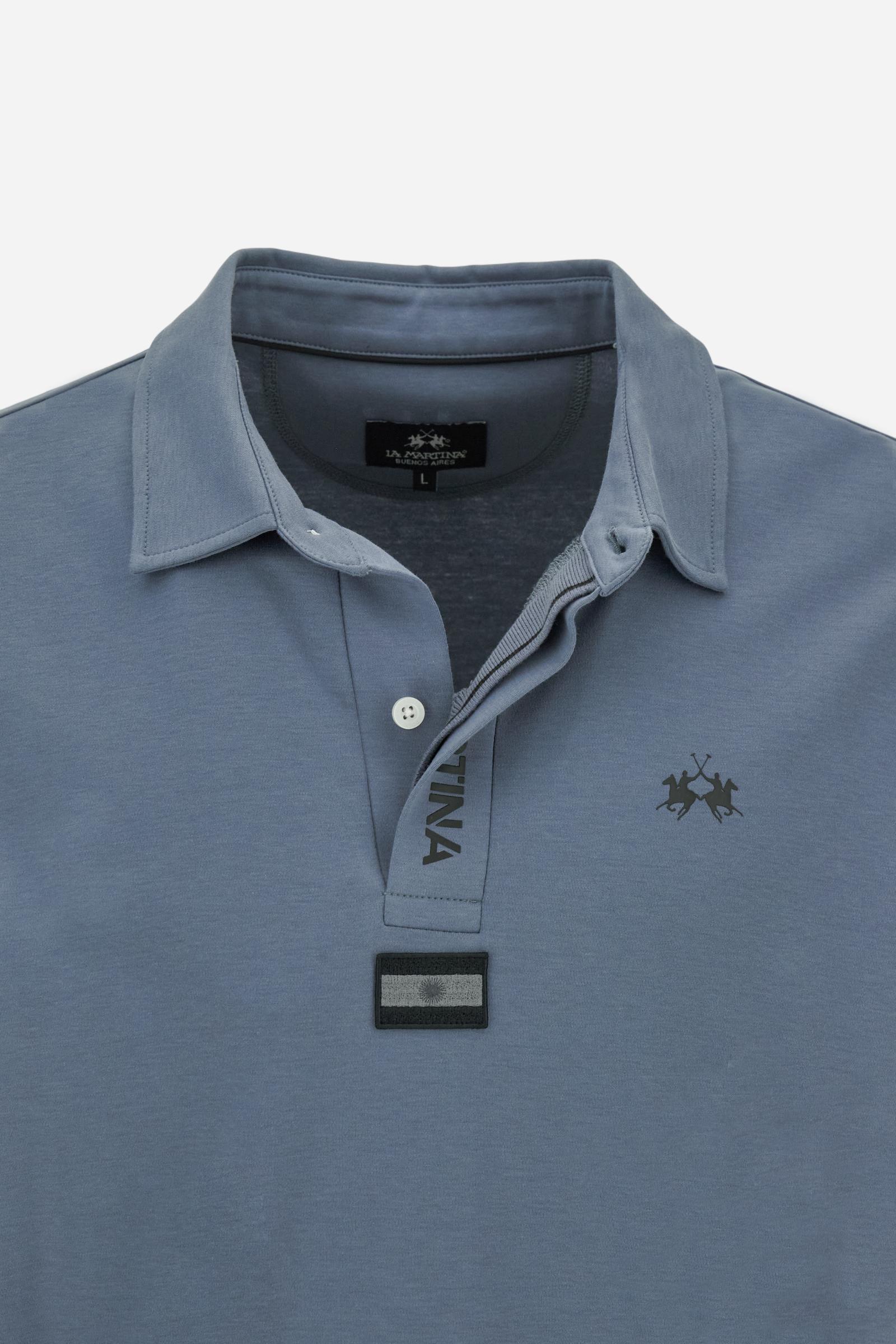Premium men’s long-sleeve polo shirt in 100% cotton jersey with a smooth, silky texture. Hidden button placket and vertical contrast print. Patches dedicated to the Asociación Argentina de Polo (AAP) on the sleeve and below the opening. Small semi-transparent contrasting logo printed on the chest. Regular fit. The model wears size L. - Flint Stone