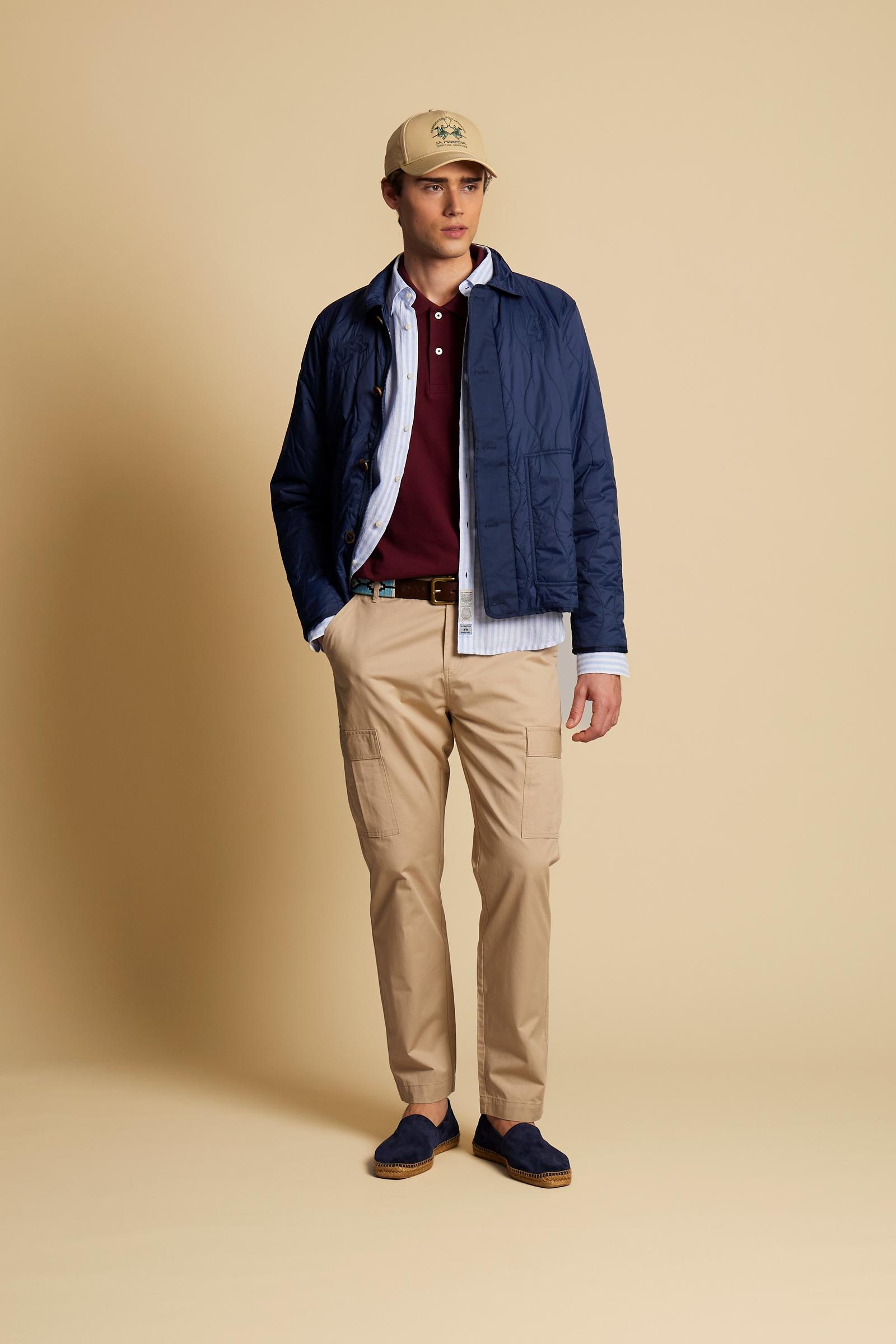 Men’s quilted nylon overshirt featuring a wave pattern, zip and horn-effect button fastening, large front pockets, and an embroidered logo on the back. Regula - Navy