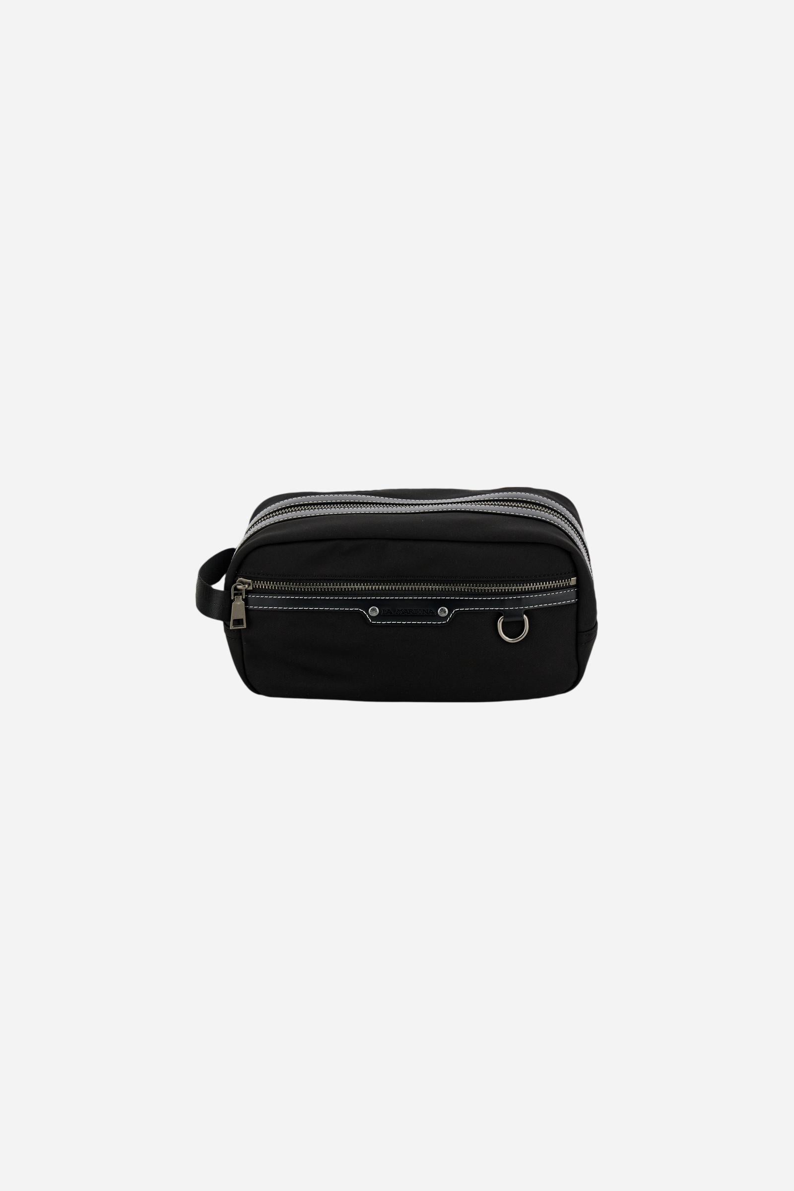 Travel case in matte technical canvas with eco-leather details, double zip compartment and maxi logo on the front. - Black