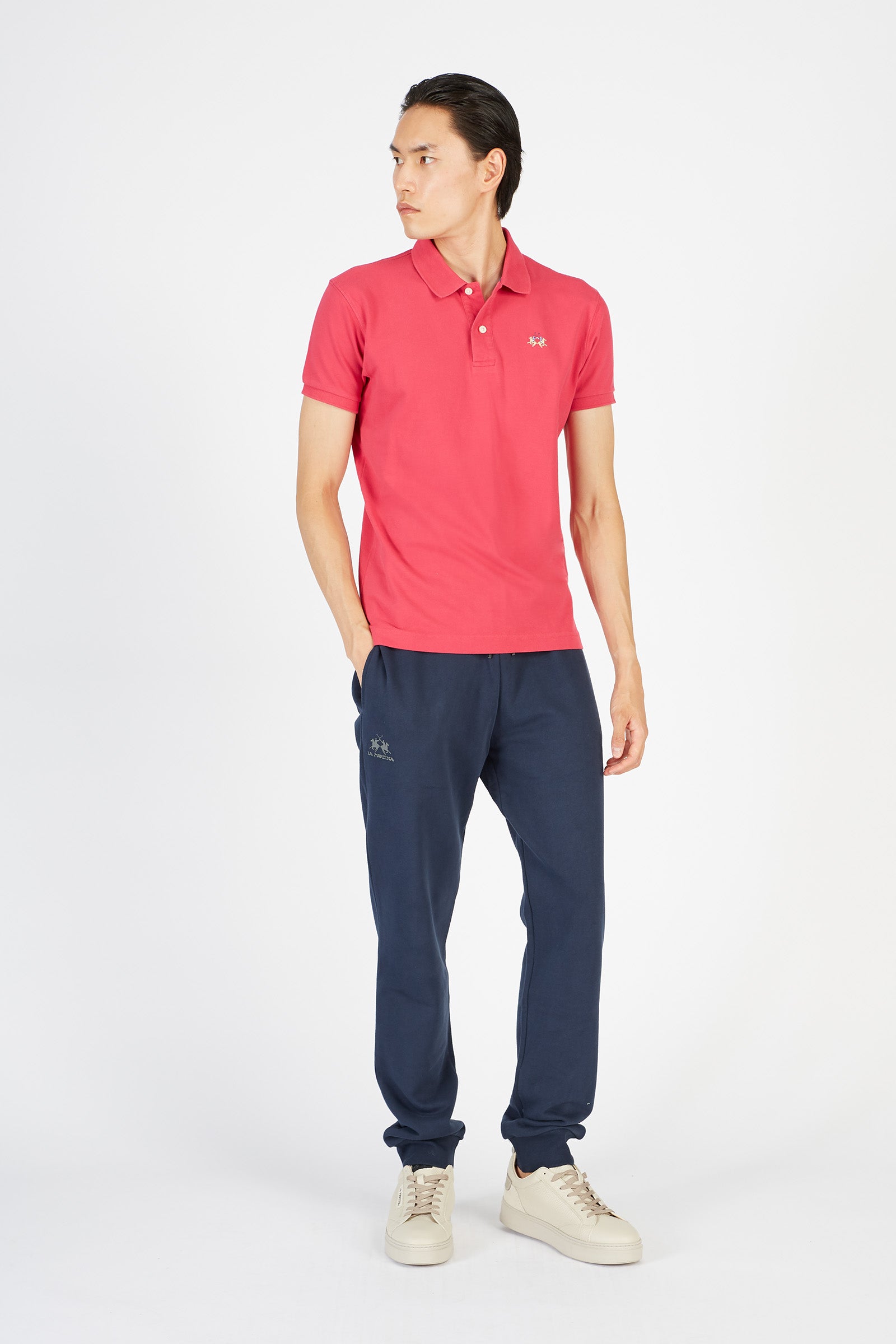 Men's short-sleeved, slim-fit polo shirt. A classic model with a contrasting embroidered La Martina logo-embellished chest. Perfect when worn with a pair of jeans from the collection. - Raspberry Wine