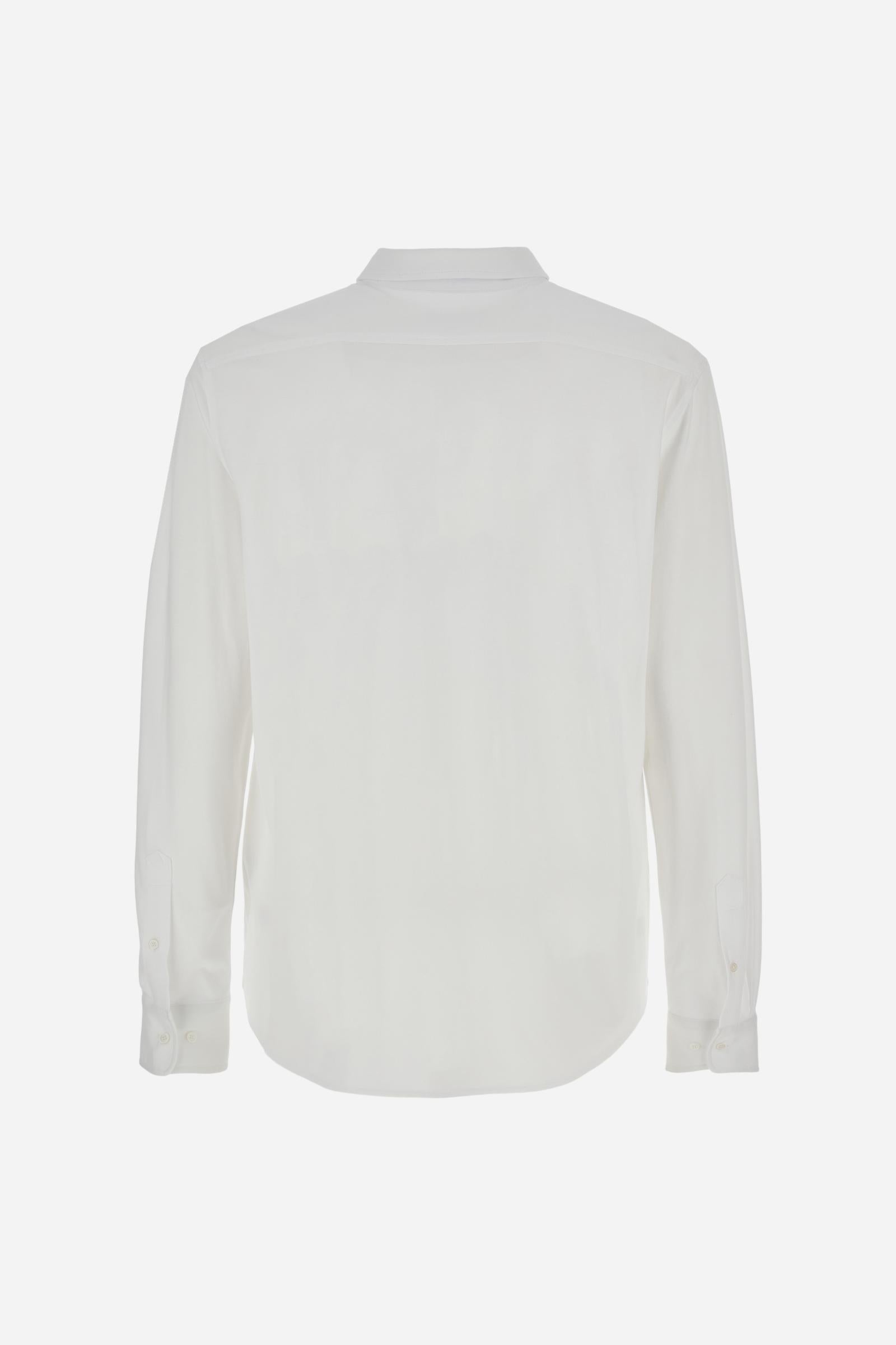 Men's long-sleeved shirt with semi-cutaway collar. It is made of 100% cotton piqué with contrasting details on the inside of the collar. The logo is embroidered on the chest with subtle Polo Club-inspired customisation. The fit is regular and offers a classic, relaxed silhouette. The model is wearing a size L. - Optic White