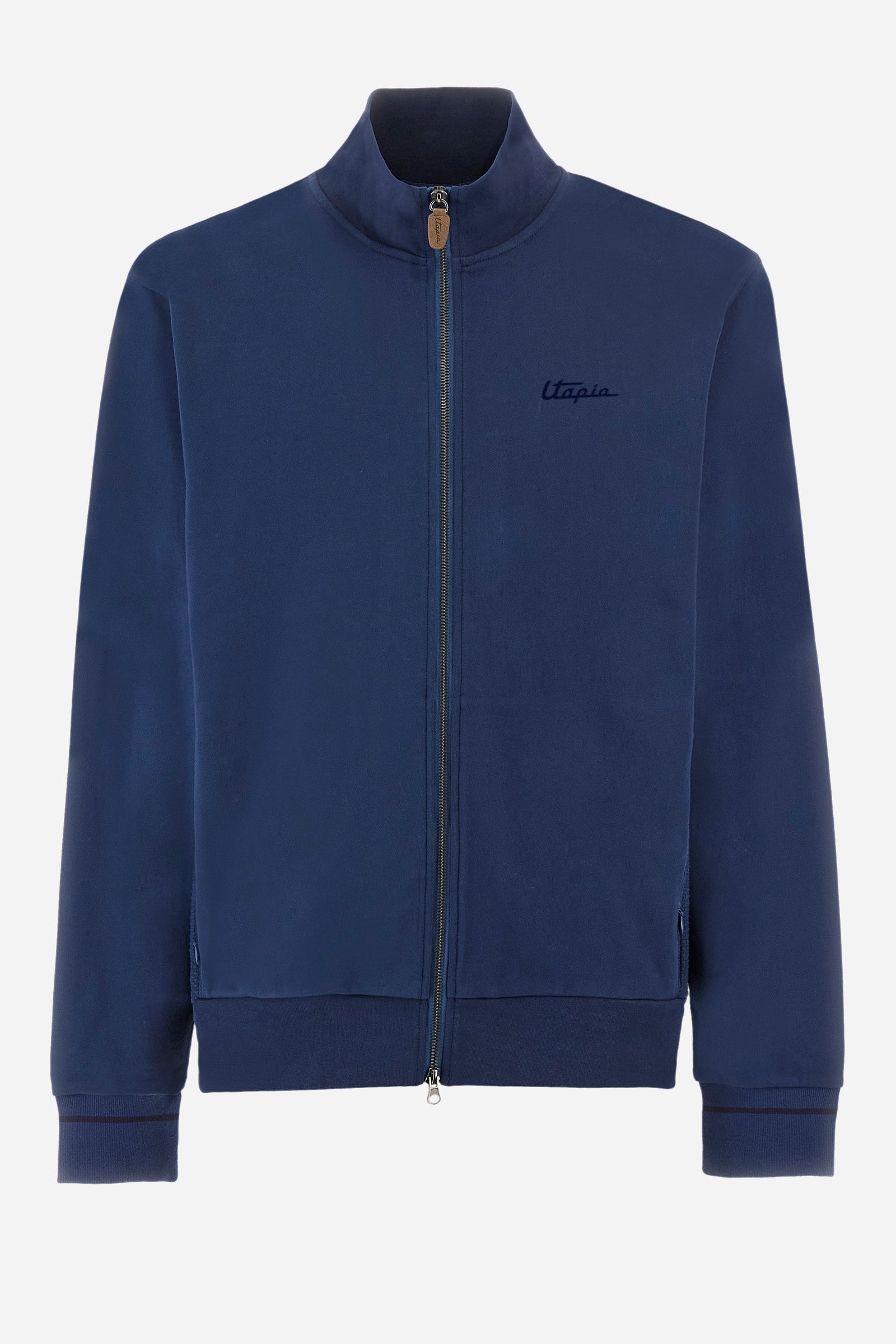 Single-colour long-sleeved men's sweatshirt with full zip fastening from the line in collaboration with Pagani. Made of 100% cotton. Mock neck, ribbed waistband and cuffs. Double back pocket. On the sides the garment has a different texture from the main part. There is lettering on the front, while a plate featuring the La Martina logo and the Pagani logo is sewn on the back. The fit is regular. The model wears a size L. - Ensign Blue