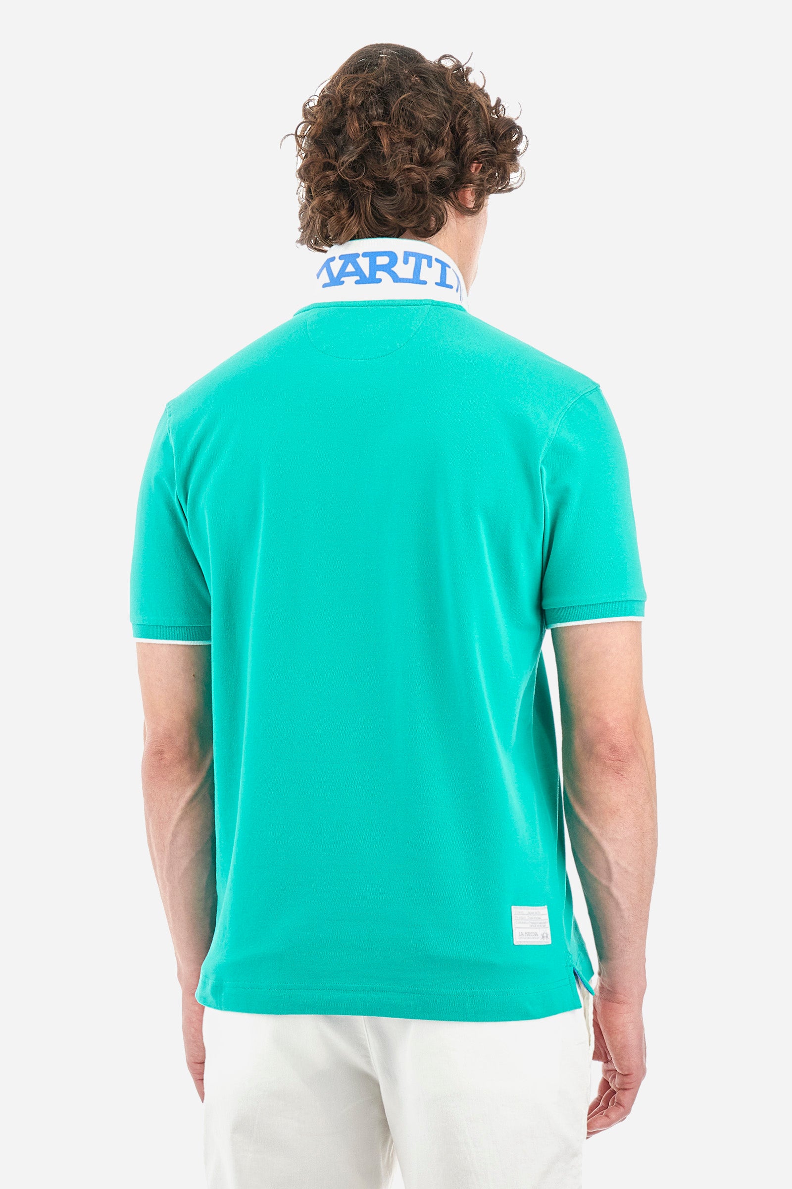 Men’s polo with short sleeves, regular fit. Made of stretch pique cotton. Classic model, with large embroidered logo in contrasting tone on the chest and profiled sleeve edges. The collar is accompanied by the writing La Martina, in contrasting tone. Ideal if worn with a denim collection. The model wears a size L. - Vivid Green