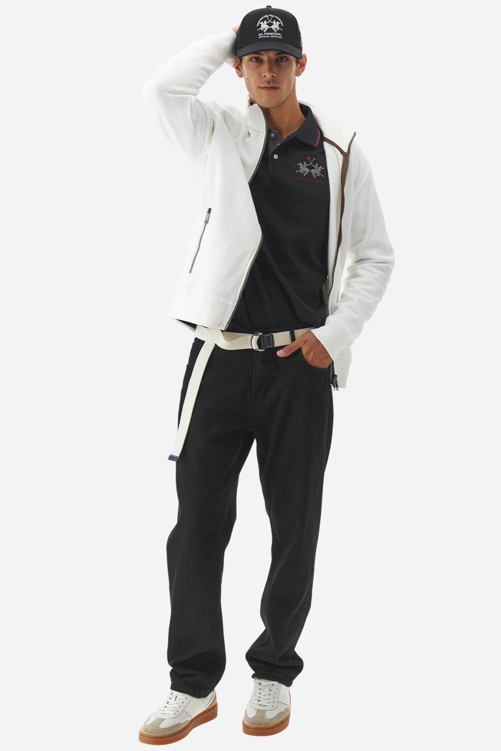 Men’s long-sleeve polo shirt in solid-colour cotton jersey with a warm, matte handfeel. Ribbed collar and cuffs with stripes and colour blocks in contrast, two personalised buttons and contrast details inside the collar. Patches and graphics on sleeves and chest celebrate the Official Polo Supplier team. The large multicolour logo is embroidered on the chest. Regular fit. The model wears size L. - Black