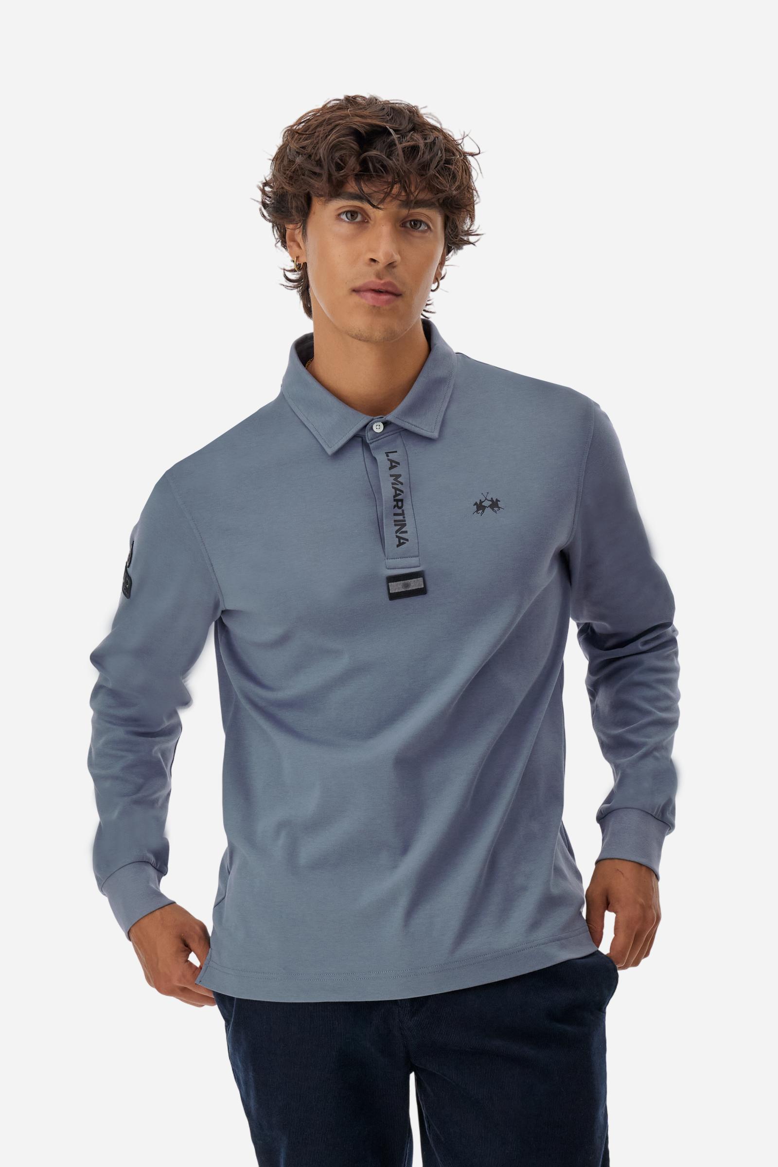 Premium men’s long-sleeve polo shirt in 100% cotton jersey with a smooth, silky texture. Hidden button placket and vertical contrast print. Patches dedicated to the Asociación Argentina de Polo (AAP) on the sleeve and below the opening. Small semi-transparent contrasting logo printed on the chest. Regular fit. The model wears size L. - Flint Stone