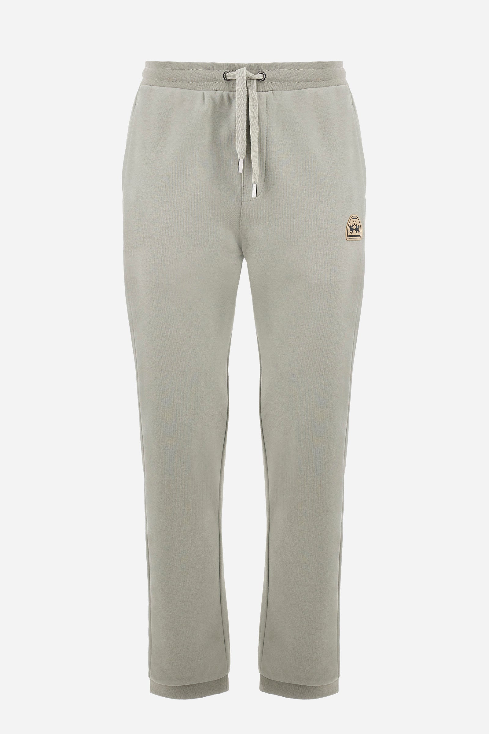 Men's single-colour jogging bottoms in a cotton sweat fabric from the Polo Academy line. With a drawstring waist and double front pocket. Another pocket is present on the back. The logo is present on a patch applied under one of the front pockets. The fit is regular. The model wears a size L. - Pussywillow Grey