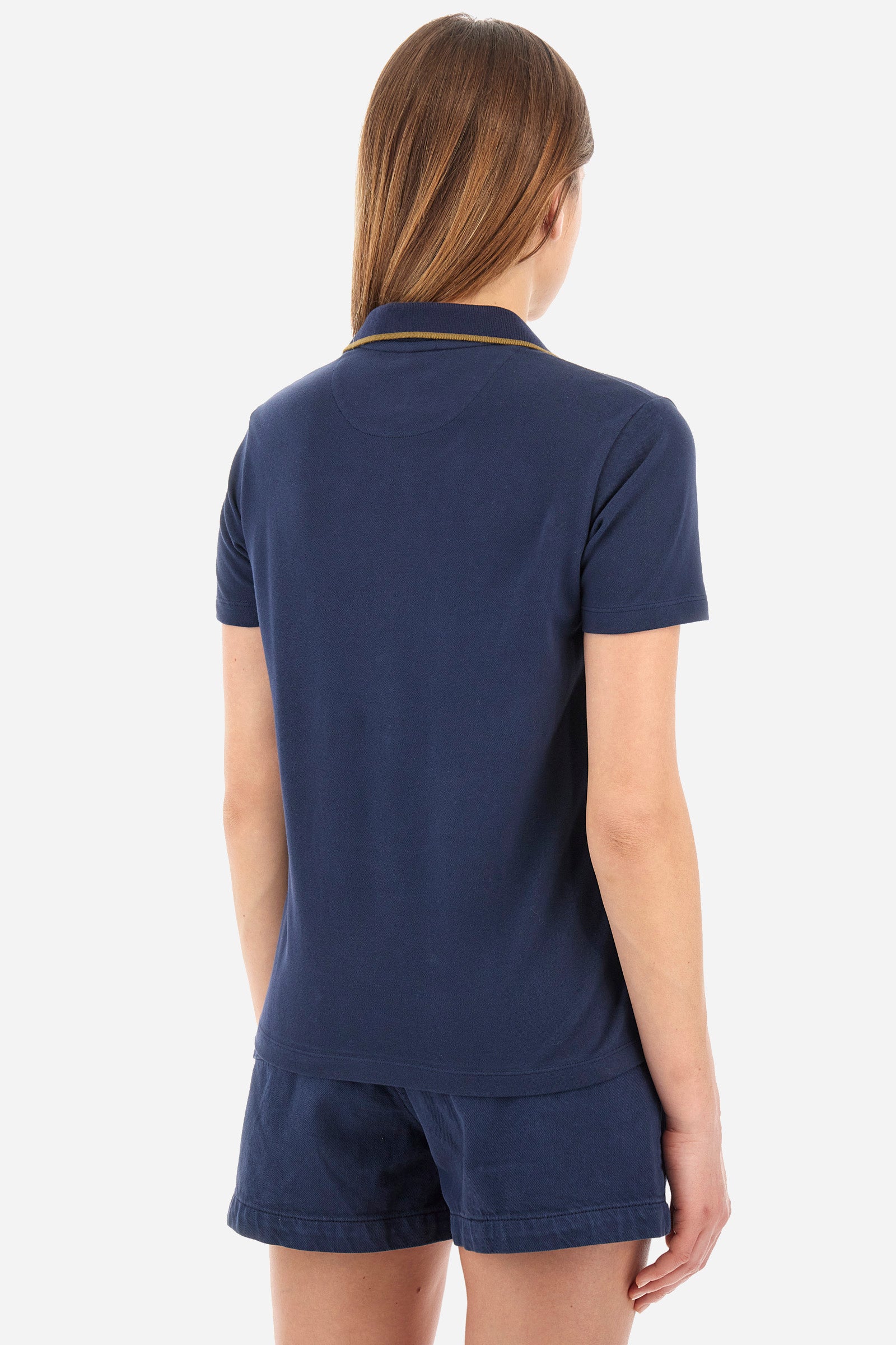 Women’s polo with short sleeves in solid color from the Guards line. Made of stretch cotton. V-neck and 2-button jewel closure. Ribbed collar. Side slits. Rhinestones of various shapes, sizes and colors were applied to the front. The logo and the characteristic symbol of the line are embroidered on a sleeve. The fit is regular. The model wears a size 2 . - Navy
