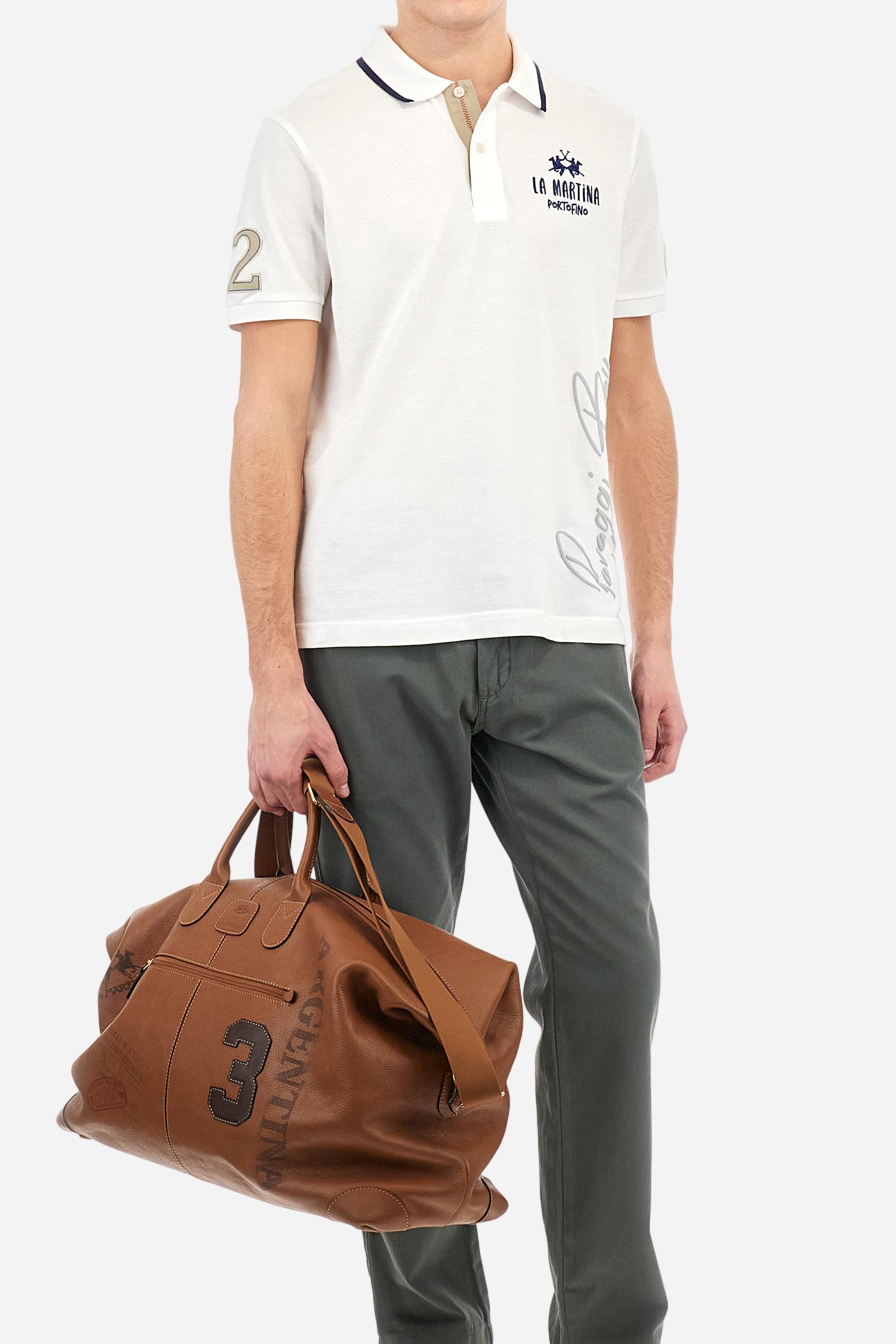 Single-colour men's chino trousers made of cotton and linen canvas. Straight leg. Zip fastening and faux horn button. The side pockets are inserted in the side and on the front, at the right, under the strap, there is a small coin pocket. The back pockets are double-welted and fasten with a visible faux horn button. The logo is present on a fabric patch sewn on the back. Regular fit. The model is wearing a size 33. - Thyme