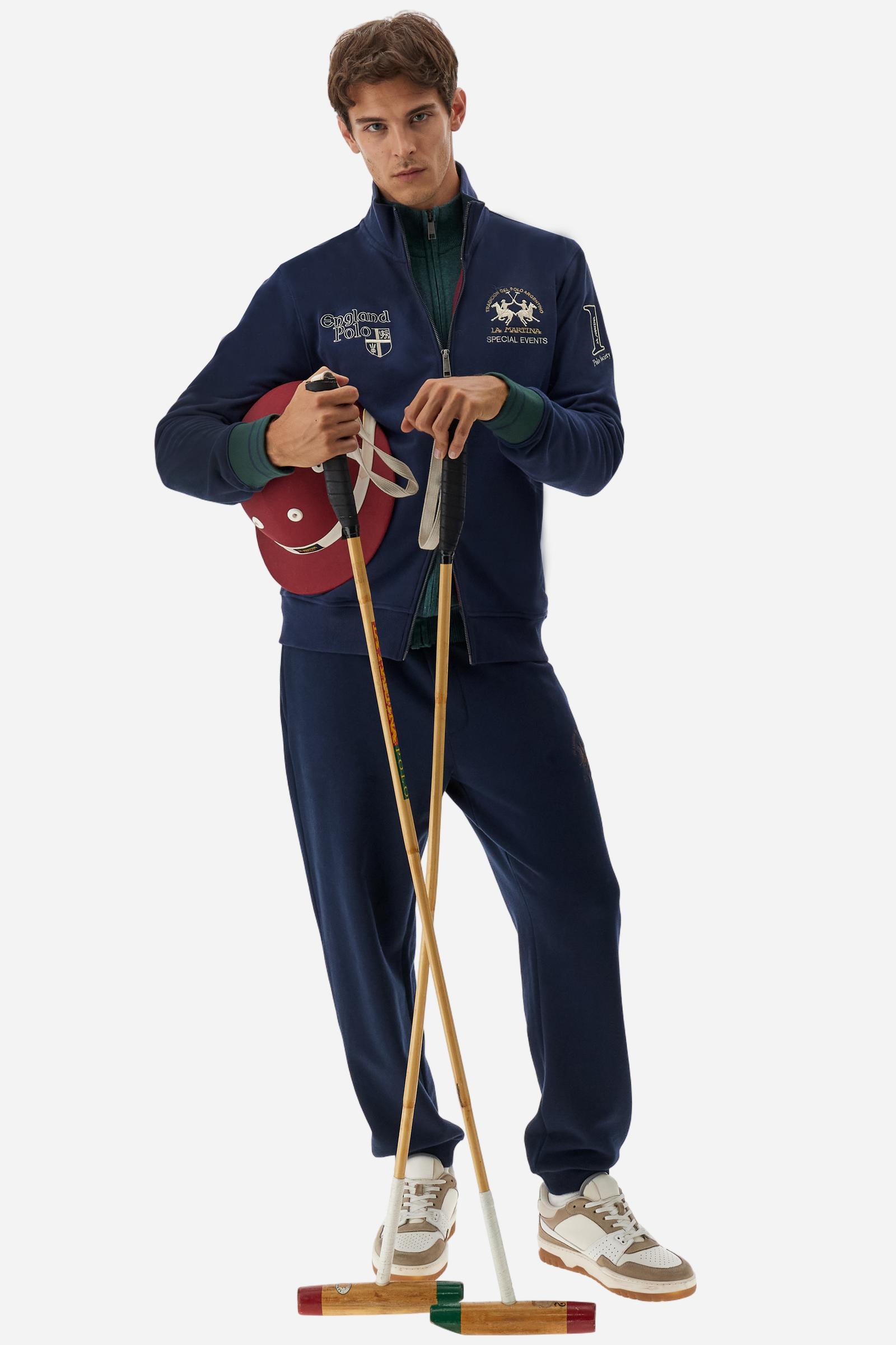Men's long-sleeved sweatshirt in solid cotton with customised front zip. Contrast rib cuffs and inner collar with multicolour stripe add character. Chest and sleeve decorated with graphics dedicated to the English polo team, large embroidered team logo on the chest. Regular fit providing comfort and functionality. Model wears size L. - Navy