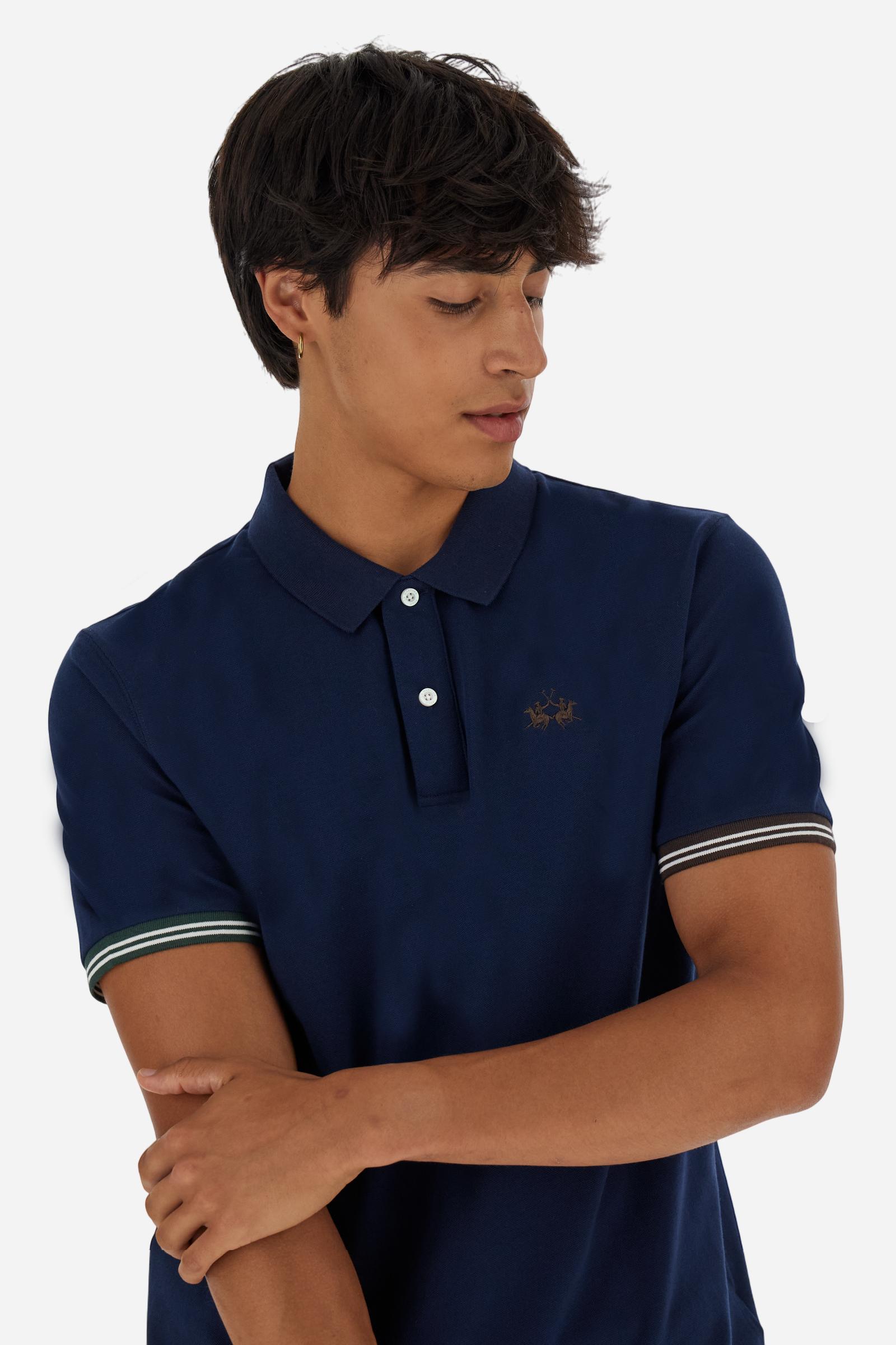 Men’s short-sleeve polo in high-quality stretch cotton piqué, ensuring excellent breathability and flexibility. Classic ribbed collar, two-button placket with customized buttons. Inner collar enriched with contrast tapes and colors for a modern touch. Multicolored ribbed cuffs with different patterns. Small contrast logo embroidered on the chest. Regular fit. Model wears size L. - Navy